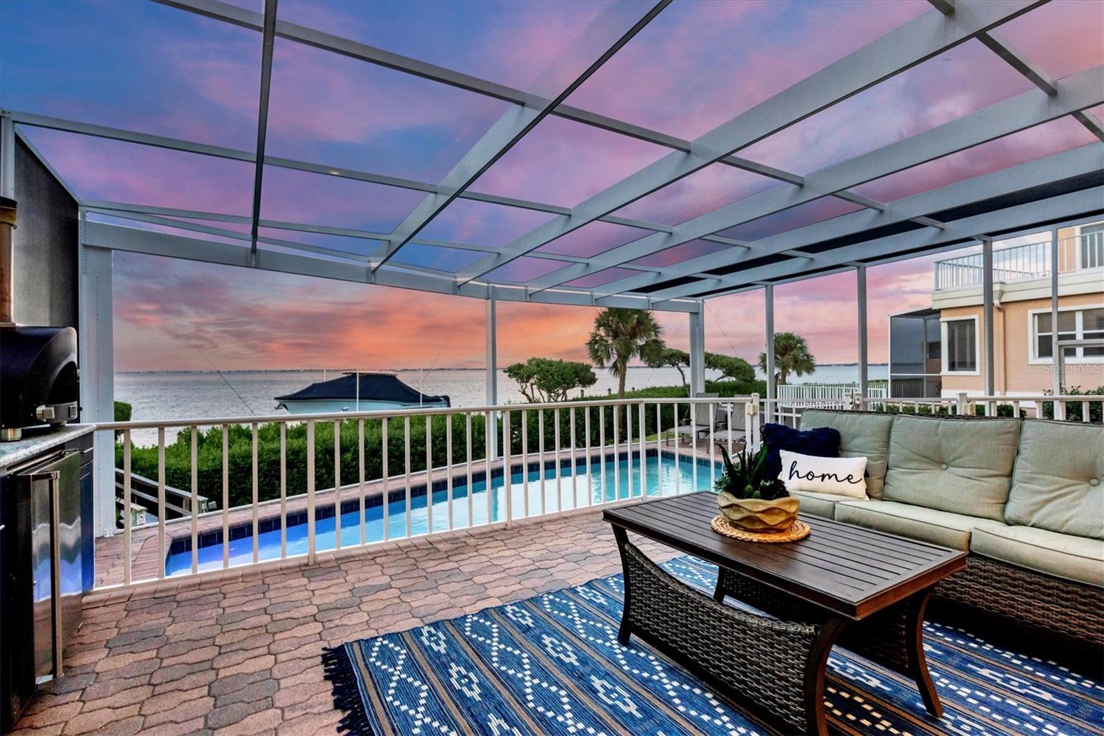 Experience the epitome of luxurious coastal living in this stunning, fully renovated waterfront villa, nestled in the exclusive Bay Isles’ coveted Corey's Landing neighborhood. This waterfront gem offers the most breathtaking unobstructed views of the Sarasota Bay and skyline. Designed with a nautical lifestyle in mind, this home features a brand new 55’ dock and boat lift that can accommodate a 35’ vessel, as well as private kayak launch. Imagine the thrill of setting sail at sunrise or embarking on serene sunset cruises, all from the comfort of your own backyard. 

Step inside this meticulously renovated sanctuary, where every detail has been carefully curated to exceed your expectations. The open floor plan seamlessly blends sophistication with comfort, creating a space that is both inviting and awe-inspiring. With its impressive 23’ ceilings in the main living area and spacious white kitchen adorned with new Thermador appliances, an oversized kitchen island, and charming farmhouse sink, this hidden gem is a true testament to elegance. The Great Room boasts a shiplap decorative wall, while the dining room offers views of an atrium with a water feature and lighting. You'll also find a drybar with a built-in icemaker, wine cooler, and beverage cooler, perfect for entertaining. With a brand new roof in place, you can bid farewell to worries about maintenance, allowing you to fully embrace the joys of waterfront living. 

The addition of a new pool cage with picture frame screens ensures unobstructed views of the Sarasota Bay, creating an atmosphere of pure serenity. Enjoy the luxury of a heated pool and spa with new pool equipment, inviting you to dive into relaxation no matter the season. And for those who appreciate outdoor living, the outdoor kitchen including grill, beverage cooler, outdoor sink, and Alpha pizza oven allows you to master the art of al fresco dining and entertaining.

With four inviting guest bedrooms and four full renovated bathrooms, everyone will enjoy a comfortable and private retreat. Upstairs, discover a versatile loft space that provides even more room for relaxation or can be easily converted to accommodate additional guests. This loft space not only expands the possibilities for hosting family and friends but also offers the potential for a home office, game room, or cozy reading nook, ensuring there's a place for everyone to unwind and make cherished memories in this waterfront paradise. You'll also find a main floor office with French doors, allowing you to work in style with stunning views of the water.

As if that weren't enough, Corey’s Landing offers resort style pool, tennis courts and exclusive access to the private Bay Isles Beach Club, complete with showers, restrooms, private storage, grills, and a beach volleyball net. Don't miss the chance to make this slice of Sarasota Bay paradise your very own. Contact us today to schedule your private tour and experience the essence of waterfront luxury living in Corey's Landing. Your dream home awaits!