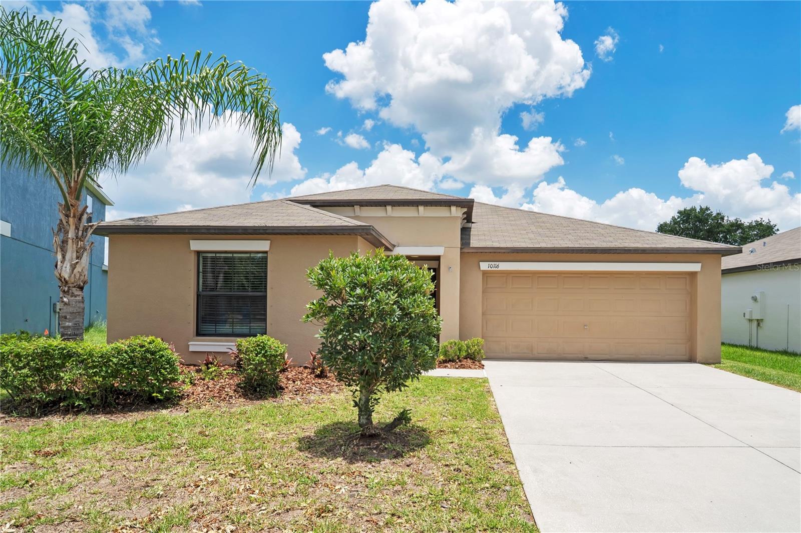 Seller offering up to $12,746 toward buyer closing costs, prepaid expenses, and/or interest rate buydown when using Seller's preferred lender. Set on a quiet lot that backs to open green space with no rear neighbors, this single-story 4-bedroom, 2-bath home offers a private setting that's hard to find. Built in 2017 in Ayersworth Glen, it gives you 1,936 square feet of single-level living with large ceramic tile throughout and no carpet anywhere. Step inside to an open-concept great room under a vaulted ceiling, where living, dining, and kitchen flow together beneath ceiling fans and recessed lighting. The kitchen is the heart of the home, with rich wood cabinetry, granite counters, stainless steel appliances, a center island with breakfast bar, a walk-in pantry, and a separate dining area framed by a wall of windows over the backyard. The split-bedroom plan tucks the primary suite on its own private wing, with a large walk-in closet, dual-sink granite vanity, and walk-in shower. Three secondary bedrooms sit on the opposite side, served by a second full bath with granite vanity and tub/shower combo. A dedicated indoor laundry room adds convenience, and sliding doors open to a large backyard with open-space views. The home is freshly cleaned and move-in ready, with a fresh exterior repaint to follow pending HOA color approval. Explore the immersive VR tour to walk through every room before you visit. Residents enjoy two community pools, a fitness center, basketball court, and playground, all for a low HOA fee, with the CDD included in the annual tax bill. Wimauma puts you near shopping, dining, healthcare, and Apollo Beach, with easy access to I-75 and US-301 for the Tampa Bay area. Incentive subject to lender approval, loan program restrictions, and terms outlined in the executed contract.
