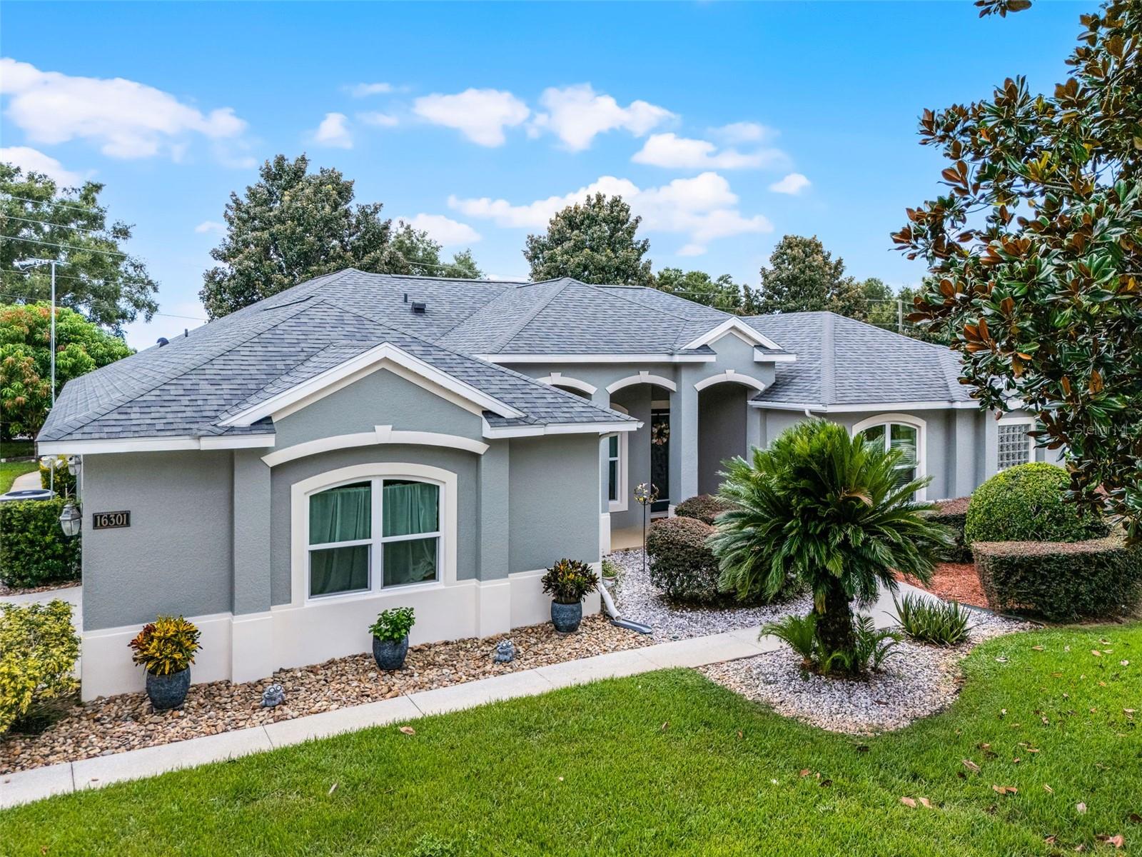 Impeccably maintained 4-bedroom, 3-bath pool home offering 2,800 square feet of beautifully designed living space in Magnolia Terrace, one of Montverde’s most sought-after communities. The spacious primary suite serves as a exclusive retreat with direct access to the pool. It has 2 walk-in closets, and a luxurious en-suite bath featuring dual vanities, a soaking tub, and an oversized walk-in shower. A separate bedroom with its own private entrance and bath is ideal for guests, multigenerational living, or an in-law suite. Two additional bedrooms provide flexible space for family, a home office, or hobbies. Step onto the covered patio, to your own private oasis featuring a screened, solar-heated saltwater pool, perfect for relaxing or entertaining year-round. Enjoy breathtaking sunset views and even Disney fireworks from the comfort of your lanai. Situated on more than half an acre, the property is enhanced by mature landscaping, fruit trees, and plenty of room for outdoor activities or gardening. Additional highlights include an oversized 2-car garage and a spacious laundry room with abundant storage cabinetry and a large utility sink. Ideally located just minutes from Bella Collina Golf Club, Montverde Academy and top-rated schools, local dining, shopping, with convenient access to major highways and Central Florida's attractions. This home perfectly blends the peaceful charm of Montverde living with everyday convenience. Recent updates include a new roof (2020), upgraded HVAC system (2023), new windows and doors (2022), new water heater (2021), and freshly painted interior and exterior. Priced to sell.