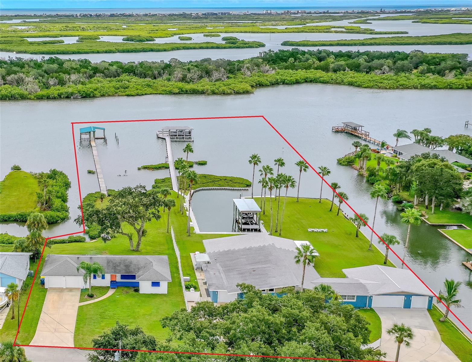 THIS OFFERING IS FOR 2-RIVERFRONT HOMES. TOTAL LAND MASS IS 1.36 ACRES WITH RIVERFONTAGE MORE THAN 600 FT. IN THE CITY OF EDGEWATER IT ALLOWS SHORT TERM RENTALS. LIVE IN ONE RENT THE OTHER OR CONNECT BOTH HOMES FOR A GREAT FAMILY COMPOUND. THIS DIRECT RIVERFRONT PARADISE IS BIG ENOUGH TO BE YOUR OWN MINI MARINA AND FAMILY RETREAT; LOTS OF RIVERFRONT DOCKAGE & A PRIVATE LAGOON. LOTS OF SEA WALL, PLENTY OF SPACE TO PARK BOATS, JET SKIS & EVEN YOUR FRIENDS BOATS. THREE HIGH END BOAT HOUSES AND THREE BOAT LIFTS. RIVERFRONT LIFT WILL HOLD 10,000LBS WITH A 35+FT BOAT. BOATHOUSE AND LIFT HAS TV HOOKUP, ELECTRIC, WATER & USB PORTS, MOOD LIGHTING, & LOTS OF SEATING FOR ENTERTAINING OR JUST WATCHING THE BEAUTIFUL SITES ON THE RIVER. THE LAGOON HAS AN UNCOVERD BOAT LIFT & A COVERED BOAT HOUSE AND LIFT. THE NEW STARCRAFT TRI TUNE PONTOON BOAT WITH 200 HP YAHAMA MOTOR COULD BE NEGOTIATED IN SALE. THE LARGER HOME IS BEAUTIFULLY DECORATED AND HAS A LARGE OPEN FLOOR PLAN &  A MAJOR RENOVATION INCUDING CUSTOM KITCHEN, WITH LOTS OF STORAGE, QUARTZ COUNTER TOPS, & OVERSIZED KITCHEN ISLAND. TASTEFULLY DESIGNED WITH CROWN MOLDING AND CUSTOM DOORS AND WINDOWS. THE LARGE MAIN BEDROOM HAS EASY ACESS TO THE HOT TUB/JACUZZI ROOM. THE MAIN BEDROOM HAS CUSTOM BATHROOM WITH HIS & HER SINKS, TUB & SHOWER. THE THIRD BEDROOM COULD BE A MOTHER-IN-LAW SUITE AS IT HAS A SEPARATE ENTRANCE & ITS OWN ENSUITE. THE HOME HAS A VERY LARGE WORKSHOP WITH A DOOR OUT TO THE YARD, PLUS AN OVERSIZED 3-CAR GARAGE WITH CUSTOM BUILT IN STORAGE. THE 3-CAR GARAGE HAS GARAGE DOORS ON THE FRONT AND ONE GARAGE DOOR THAT LEADS TO THE RIVER. THERE IS A SEPARATE ADDITIONAL 1 CAR GARAGE WITH CUSTOM CABINETS FOR STORAGE & IT HAS ACCESS FROM THE LAUNDRY & A DOOR TO THE OUTSIDE. THE 65 FT GREAT ROOM HAS CUSTOM WINDOWS WITH GREAT RIVER AND LAGOON VIEWS. CUSTOM UP & DOWN SHADES GIVES YOU PRIVACY AS WELL AS ALLOWING SUNLIGHT IN OR OUT. ALL NEW CUSTOM WOOD FLOORING, TV AND ELECTRIC OUTLETS EVERYWHERE. FULL HOME GENERATOR, SPRINKLER SYSTEM, SECURITY CAMERA SYSTEM WITH 11 CAMERAS. ELECTRONIC DOUBLE GATE & STORAGE UNIT 35 X 20.  THE SECOND HOME IS  FRESH AND MORE THAN FUNCTIONAL. CUSTOM DESIGNED COUNTERTOPS HAVE BUILT-IN HIDDEN ELECTRIC & USB OUTLETS. LOTS OF SPECTACULAR DRAWER SPACE WITH INSERTS THAT WILL KEEP EVERYTHING ORGANIZED. SEE BEAUTIFUL VIEWS OF THE RIVER THROUGH THE LARGE CUSTOM-MADE HURRICANE RATED WINDOWS. THIS HOME HAS A LUXURIOUS STYLE THAT USES ORDERLY ELEMENTS TO CREATE BEAUTIFULLY PROPORTIONED SPACES FULL OF COLOR WITH A SENSE OF ENERGY & VIBRANCY. ALL NEW APPLIANCES, CUSTOM CEILING FANS, INSIDE LAUNDRY, LARGE TILED BATHROOMS WITH GLASS SHOWER ENCLOSURES & MANY MORE UPGRADES INCLUDING NEW INSULATION THAT DECREASES UTILITES AND A SPRINKLER SYSTEM ON A DEEP WATER WELL. THE OVERSIZED TWO CAR GARAGE IS A BONUS AND COULD BE CONVERTED TO A FAMILY ROOM, ADDITIONAL BEDROOM SPACE OR WORKSHOP PLUS GARAGE. THIS ONE-OF-A-KIND PROPERTY IS LOCATED IN A CUL-DE-SAC COMMUNITY WITH DEEDED ACCESS TO A BOAT LAUNCH. ;Water: City