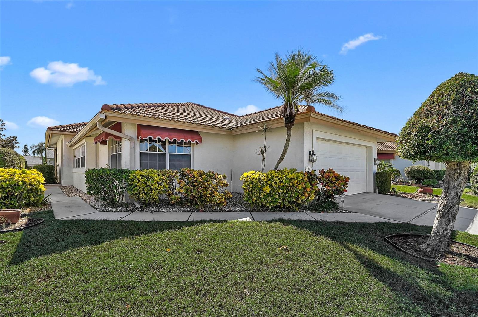 $20,000 price improvement! Roof just pressure washed 03/31/2026! Welcome to Peridia Golf & Country Club, where this well-maintained 2BR/2BA patio home offers easy Florida living in one of Bradenton’s most desirable golf communities. Sunlight fills the home through large windows, creating a bright and inviting feel. Enjoy the spacious screened lanai—perfect for relaxing or entertaining—while the HOA handles lawn care for low-maintenance living. Wood flooring flows from the entry into the kitchen and eat-in area, adding warmth and charm. The kitchen features granite countertops, ample cabinetry with pull-out drawers, and a cozy breakfast nook with a built-in counter—ideal for coffee in the morning or wine and appetizers in the evening. Primary suite includes a walk-in closet and en-suite bath with dual sinks and a shower. A split floor plan offers privacy, with the 2nd bedroom near a full guest bath featuring dual sinks and a tub/shower combo. Recent updates include a new A/C and new lanai screens. Enjoy resort-style amenities including an 18-hole executive golf course, clubhouse, heated pool, tennis and pickleball courts, plus a full-service restaurant and Tiki bar. Conveniently located near shopping, dining, airports, and Gulf beaches—this home is ready for you to add your personal touch and enjoy the Florida lifestyle! Fees include a $4,000 One Time Capital Reserve, $600 Qrtly Yard Maintenance, $938 Qrtly Master Association, $600 Annual food/beverage Minimum, and a $100 One Time Admin Fee to Peridia. Contact us to schedule your private tour today!
