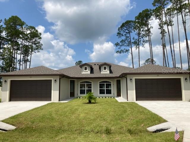 You have not seen a duplex like this in Palm Coast!! This almost brand new duplex is spacious with only high end EVERYTHING inside! It even features a screened in lanai and FULLY FENCED BACKYARD on BOTH SIDES!! Two car garage. Beautiful cabinetry and granite countertops are in the kitchen and bathroom. Wood grain tile floors in main area and LVP in bathrooms. Come see it today!