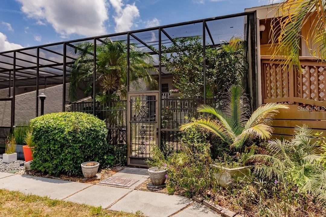 ***5% financing for qualified buyers for two years. Seller will buy down your mtg. rate for two years to only 5% - FURNISHED*** Tucked behind Bobby Jones Golf Course, "The Hideaway" is one of Sarasota’s best-kept secrets. This uniquely designed condo offers a peaceful retreat with vaulted ceilings, stunning golf course views, and a private, screened courtyard. The outdoor space features lush plantings, stepping stones, and an upper wood deck, creating a serene environment perfect for relaxation or a play area for pets.

Inside, the condo is turn-key furnished and thoughtfully designed for both comfort and style. Wood and slate floors add warmth and character, while the living space is enhanced by a built-in electric fireplace and custom wall unit. Natural light pours in through 12 feet of sliding glass doors, opening to the upper deck—the ideal spot for unwinding at sunset.

The kitchen is fully equipped with newer appliances, including a stainless steel refrigerator and dishwasher, along with cookware, dishes, and glassware. A walk-in closet offers ample storage, and the in-unit washer and dryer add convenience. The bedroom is furnished with a queen-size bed dressed in luxurious 850+ thread count sheets, while two HD TVs with 120 channels and high-speed Comcast Wi-Fi provide entertainment and connectivity.

The condo's surroundings are just as inviting, with a screened-in foyer and garden area, a wood deck with wicker furnishings, and a charcoal grill for outdoor cooking. A large open green space just beyond the door leads to moss-covered ancient oaks and a small creek, while the newly reopened Bobby Jones Golf Course provides a beautiful, expansive backdrop. A swimming pool is just steps away, offering a refreshing escape.

With assigned parking and a convenient location near shopping and dining, this condo is also within walking distance to the bus stop for easy access to downtown Sarasota. Even better, all special assessments have been paid in full by the seller! Whether you are looking for that perfect, affordable vacation home, an investor in search of an income property, or a first-time homebuyer looking for a comfortable property that can later be used as a rental, "The Hideaway" offers privacy, comfort, and the best of Sarasota living.