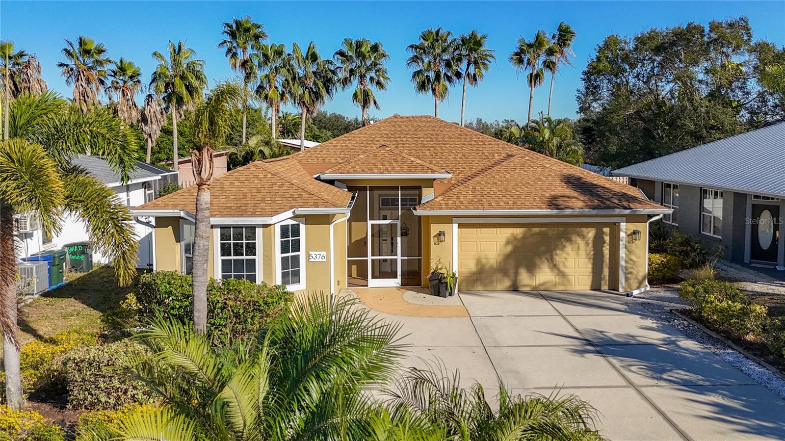 Welcome to Levi Lane! This rare 3-bedroom, 2-bath pool home is tucked away on a charming cul-de-sac in an unbeatable location. Inside, you’ll find a blend of ceramic tile and wood laminate flooring, granite kitchen countertops, and a bright eat-in kitchen surrounded by beautiful windows overlooking the expansive screened lanai and sparkling heated saltwater pool. Both the kitchen and the main living area feature large pocket sliding doors, creating an open, airy flow that’s perfect for entertaining and indoor/outdoor living. The interior laundry room offers a laundry tub, storage cabinets, and a large window that fills the space with natural light. The spacious primary suite includes a sliding door, oversized window, and walk-in closet. The ensuite bath features a walk-in shower with a window and dual sinks for added convenience. A welcoming foyer greets you upon entry, while the split-bedroom floor plan provides privacy with a hallway leading to the second and third bedrooms and a roomy second full bath. Conveniently located near I-75, Siesta Key, and UTC shopping and dining. Roof replaced in 2022 and newer A/C—this home is priced to sell. Schedule your showing today!