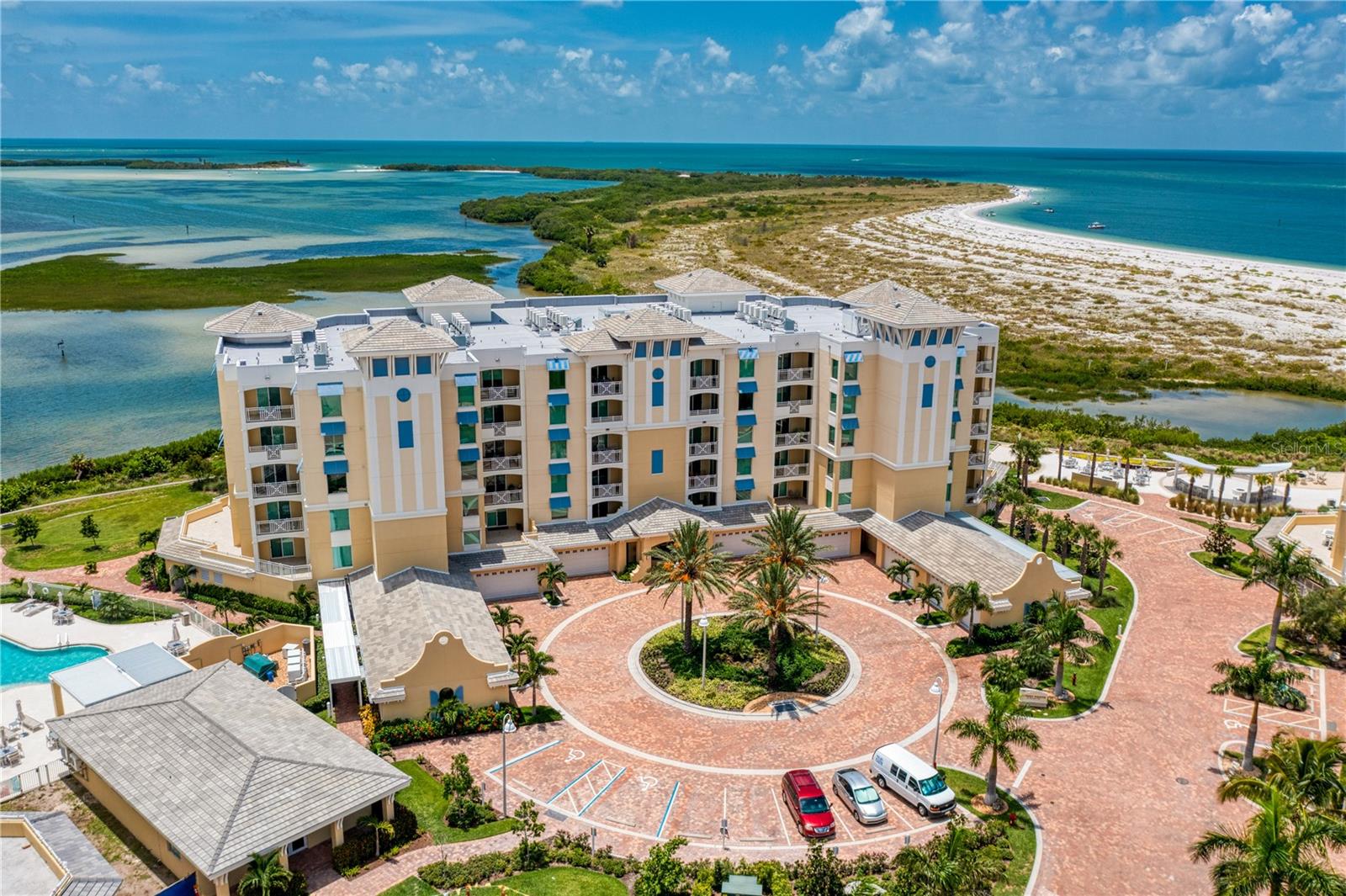 One or more photo(s) has been virtually staged. NESTLED WITHIN A PRIVATE, 18-ACRE, GATED GULF FRONT ENCLAVE.  BUIT IN 2020 THIS SPACIOUS AND LUXURIOUS UPPER-FLOOR RESIDENCE BOASTS DRAMATIC PANORAMIC VIEWS OF THE GULF OF MEXICO!  Secured elevator access opens to a private double-door entry foyer and a fabulous open-concept floor plan with gorgeous flooring, 10ft-high ceilings and a resplendent minimalistic appeal.  Your sumptuous chef’s kitchen provides fine quartz surfaces, high-quality Subzero/Wolf appliances, elegant coastal-white cabinetry and a center island breakfast bar with service area.  The large and airy great room, with its wall of glass overlooking the water, opens to a generous 200sqft covered balcony that delivers sweeping, unobstructed views of the Gulf of Mexico and Shell Key with dazzling sunsets and moonlit nights over water. A graceful double-door entry introduces the exceptional owner’s suite - with grand window views of the Gulf, private access to the covered Gulf front balcony and two wonderful walk-in closets. The owner’s bath is lavishly designed with dual vanities, dedicated cosmetics center, quartz surfaces, a luxurious step-in spa tub and a terrific oversized walk-in rainshower glass enclosure with bench and multiple shower heads.  The attractive 2nd and 3rd bedroom suites feature generous walk-in closets, access to a private covered balcony with water views, and posh full baths with superb vanities and tastefully-finished shower/tub areas.  You will appreciate the large private laundry facility and its generous storage, the high-quality water-softening system, your dedicated office/den (ideal for organizing business/home operations) and your highly-desirable private two-car garage.  Collany Key offers many exceptional amenities including direct beach access, a terrific fitness center, large pool/hot tub, covered bar/dining area, extensive walking trails, putting green and bocce court.  Enjoy miles of tranquil, sandy shoreline while taking in the natural surroundings and remarkable marine life!  A lifestyle of kayaking, fishing and windsurfing are a few short steps away.  Explore the beaches and facilities of internationally renowned Ft. Desoto Park, an easy bike ride or short drive away.  The finest private Gulf front/beachfront condominium location in the Tampa Bay area, with fast, easy access to downtown St. Pete and Tampa International Airport.  Dimensions are estimates, buyer to verify.  Note: Some images of this residence are virtually staged.