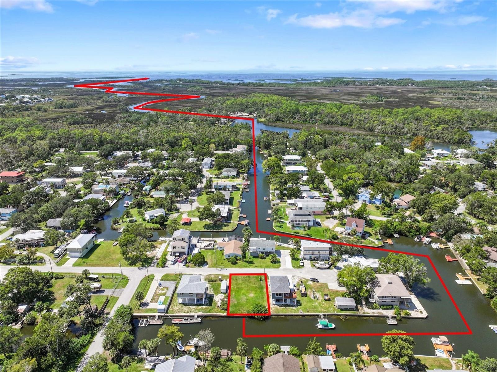 Direct Gulf Access Lot in Palm Grove Colony – Seawall in Place!

This amazing Gulf Coast Fishing lot offers 60 feet on a saltwater canal with a concrete seawall, providing direct access to the Gulf of Mexico via the Mud River with no fixed bridges. Cast for redfish, snook, and snapper right from your backyard, or watch dolphins and manatee swim past while you plan your dream home.

Welcome to Palm Grove Colony, a hidden gem in Hernando County just 60 minutes north of Tampa International Airport, easily reached via the Suncoast Parkway. This spring-fed riverfront community feels like stepping back into old Florida—peaceful, natural, and away from the hustle of US 19 and SR 50.

One of the most unique features of this neighborhood is Little Salt Spring, a community-owned spring exclusively for residents to enjoy. At the heart of the area lies the Mud River, a 3-mile-long spring-fed waterway flowing into the Gulf at Bayport and fed by both Mud River Spring and the world-famous Weeki Wachee River. With crystal-clear, 74-degree water year-round, this river is perfect for boating, fishing, snorkeling, scalloping, and even swimming with gentle manatees.

Outdoor enthusiasts will find endless opportunities for adventure here—whether it’s boating straight to the Gulf, diving into spring-fed waters, or simply relaxing in a quiet, natural setting.

If you’ve been searching for the perfect place to build your Gulf Coast Fishing Home, look no further. Palm Grove Colony is where old Florida charm meets the best of waterfront living.