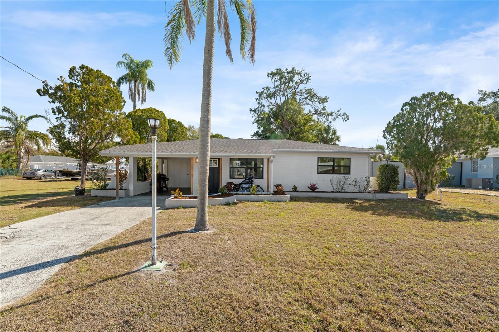 Welcome to your move-in-ready Sarasota home offering easy, low-maintenance living with terrazzo flooring throughout and a bright Florida room that adds flexible space for dining, lounging, or work-from-home needs! A newer roof and other upgrades await! A spacious backyard provides room to relax or customize to your vision. Centrally located near shopping, dining, Downtown Sarasota, and top rated beaches, this property is an excellent option for an income-producing rental, a first-time homebuyer, or someone looking to downsize without sacrificing comfort or convenience. Call to schedule a time to see this fantastic property for yourself! **THIS PROPERTY QUALIFIES FOR A 1% LENDER INCENTIVE IF USING PREFERRED LENDER. INQUIRE FOR MORE DETAILS.**