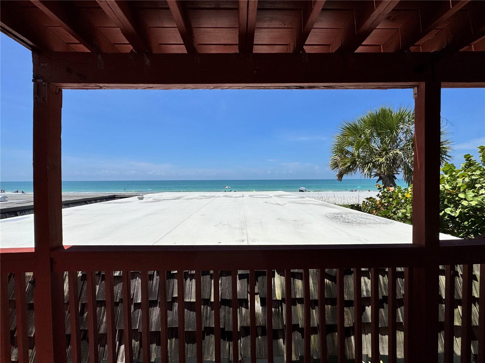 BEACH FRONT TOWNHOME! 2-bedroom, 2 bath with 3rd bath by the garage for convenience. NO RENTAL RESTRICTIONS in a PRIME LOCATION on INDIAN SHORES. Wide open living space combines the living room, kitchen and dining room. WOOD BURNING FIREPLACE in the living area on the first floor and in the primary suite on the second floor, adding a unique touch to the already charming coastal attitude of the property. Hurricane resistant sliding glass door opens to a potential patio from the dining room and a second set of sliding doors opens toward the beach from the living room providing access to a covered porch area and direct access to beach. Follow the stairs to the primary suite which presents with the second wood burning fireplace, walk in closet and bathroom with shower/tub combo and stone vanity. The guest bedroom has two closets for extra storage and private bath with oversize stone vanity and walk-in tile shower. Just outside the primary suite is the TWO-LEVEL BALCONY. It provides a breath-taking view of the Gulf of America and the white sandy beach and waves below. Feel the breeze from the 1st level or climb the stairs to the Crow’s Nest Balcony with a second panoramic view of the beach, sunset and starry night. Leave the sliding door open and hear the waves crashing or look for shells in the dark.  
Private access to your own beach with four Adirondack Chairs for your entertainment as well as a three-seat swing to enjoy the waves. The Seaside Seabird Sanctuary is just steps away and the nature reserve with Park Boulevard Boat Ramp is right across the street. There is shared laundry available. Lots of parking space and a TWO CAR GARAGE, perfect place to store your bikes and paddleboards. The property was professionally remediated after the storms and is a diamond in the rough. Such a unique property with the potential to be a strong income producer as a rental or be enjoyed as a forever home at the beach. Exceptional location, amazing property!