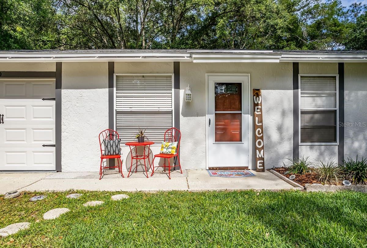 Great opportunity to own an updated house in the coveted Lake Padgett neighborhood of Land O’ Lakes, FL. Charming dwelling with no HOA, back neighbors, flood zone, or deed restrictions. The quiet neighborhood makes it a lovely landing pad for “snowbirds” and the easy access to Tampa Bay attractions makes it a good vacation rental. A 10-min drive east leads to I-75, and a 15-min drive west reaches Suncoast Parkway/Veterans Expressway, both of which provide efficient North/South access to a variety of destinations. The neighborhood is also in walking distance to Lake Myrtle Elementary, library, rec center, churches, entertainment, and shopping of all sorts, including Tampa Premium Outlets and Wiregrass Mall. The open floor plan is accentuated by the vaulted ceilings and continuous feel of the wood-look tile. The great room/kitchen combo is well laid out for entertaining and the kitchen has a modern look, with quartz countertops, stainless-steel appliances, a back splash, under-cabinet lighting, and push-to-open cabinet doors. The spacious 33’x10’ back patio (lanai) has the view of a large yard (room for a pool) adjacent to a lush wooded area. There is electrical in place for exterior sensor lights and an owned salt-water treatment system. The garage has a hurricane-rated door and it houses the laundry area and additional shelving. Meticulously maintained and the epitome of “location, location, location”, this house is ready to be seen today!