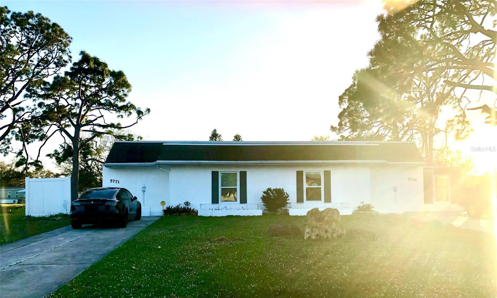 Welcome to 5771 & 5775 Gallatin Lane, a well-maintained duplex conveniently located near everything North Port has to offer—wonderful restaurants, shopping, Warm Mineral Springs, and just a short drive to Florida’s beautiful Gulf beaches. Sports enthusiasts will enjoy easy access to multiple spring training stadiums, including the new Charlotte County complex. Not in a flood zone.

Each side of this duplex features 2 bedrooms and 1 bathroom, a dine-in kitchen, a comfortable living room that opens to a private patio, and a convenient laundry room. Beautiful vinyl plank flooring runs throughout, paired with modern kitchens, and fresh interior paint in Benjamin Moore’s Chantilly Lace.

The property sits on a generous 0.47-acre lot, offering a large backyard ideal for outdoor entertaining. Public water and sewer add everyday convenience, and the new roof provides peace of mind for years to come. Utilities are separately metered.