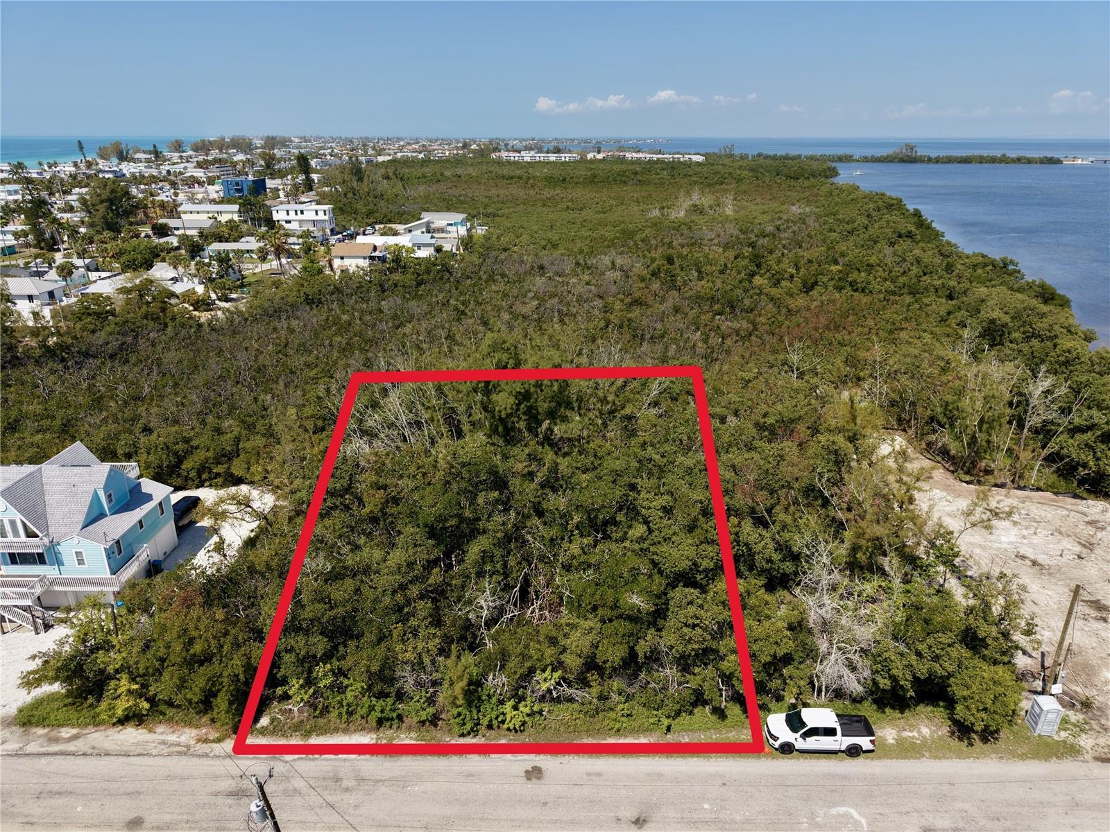 Tucked away on a serene cul-de-sac and surrounded by stunning million-dollar homes, this rare .34-acre buildable lot on Anna Maria Island is your blank canvas for creating the ultimate Florida dream retreat. Imagine a private driveway leading to a generous 2,000 sq/ft buildable footprint, where you can design a two-story home complete with a multi-car garage and pool. Nestled amidst lush woods and mangroves, this property offers the perfect balance of privacy and natural beauty.
  Dream big—picture adding a widow’s walk to take in breathtaking views of the Intracoastal Waterway’s sunrise and the Gulf of Mexico’s unforgettable sunsets. Just steps away at the end of the street, you’ll find access to one of Florida’s finest white-sand beaches, along with endless opportunities for boutique shopping and upscale dining.
  State, federal, and city compliance permits were previously obtained, and an approved survey is on hand, making the building process easier than ever. While the Army Corps permit has recently expired, it’s ready for the new owner to reinstate the permits and bring their vision to life.
  Opportunities like this are incredibly rare on Anna Maria Island—don’t let this chance to design your perfect coastal haven slip away!
