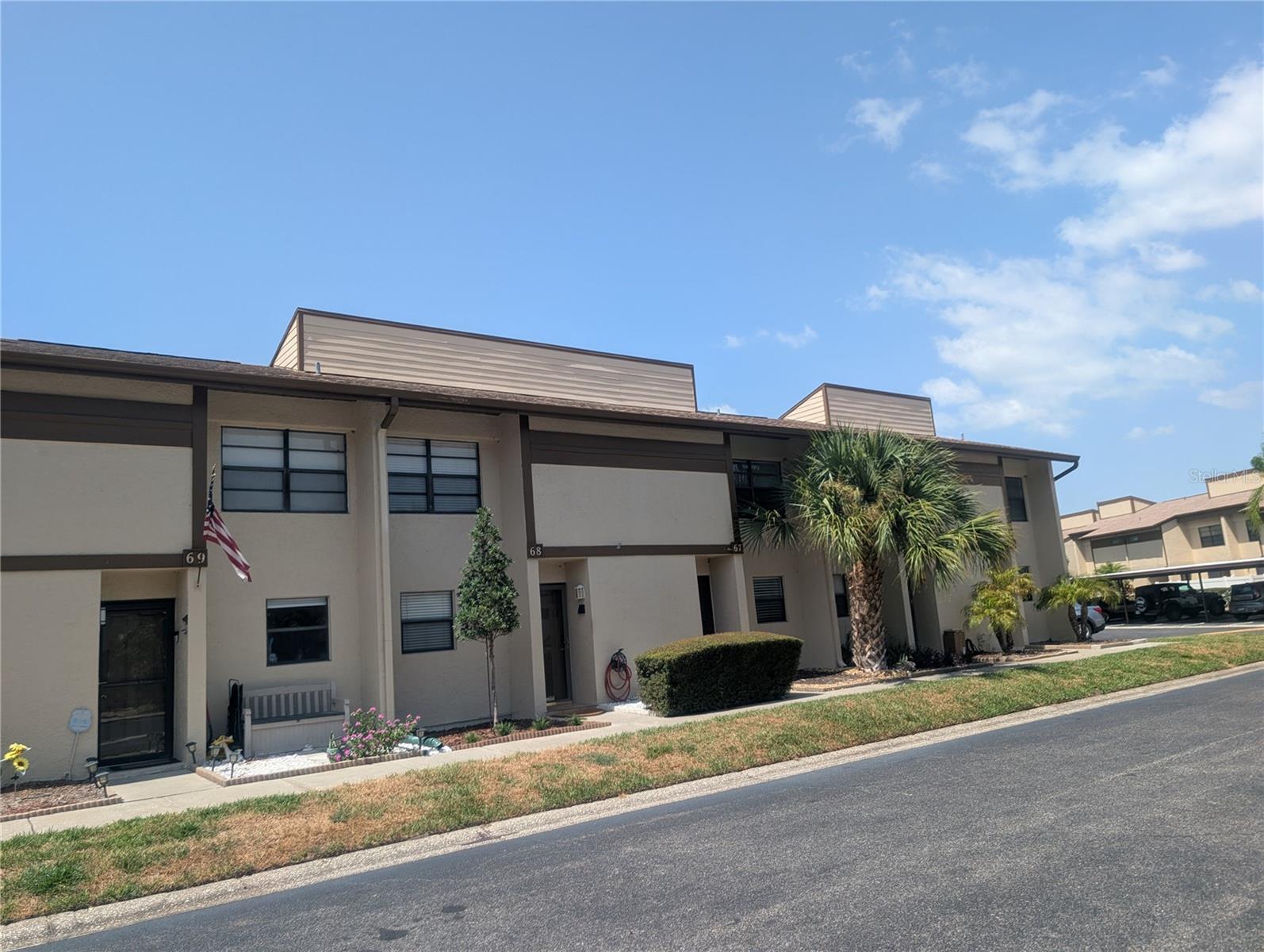 BEST VALUE in all of "Townhomes of Lake Seminole!" IDEAL FIRST-TIME BUYER'S HOME! (Fanny Mae approved complex) Or: USE AS AN INVESTMENT AND RENT! ALL AGES, 2 small pets & annual rentals ok - 2 bedroom 1.5 bath open floor plan (1,015 htd. sqft) townhouse (both bedrooms UPSTAIRS) with lovely screen porch in the back overlooking a quaint garden and green space. BRAND-NEW ELECTRIC PANEL BOX on July 15th, 2026! Attached private laundry room with washer/dryer, ceilings fans, a bright - open kitchen features a modern back splash and newer appliances. Low $600 monthly fees include: water/sewer/trash pick-up, cable, TV, Internet, building maintenance including the roof, all common areas i.e. private roads, carports, clubhouse (kitchen & community room, mail boxes), pool, tennis courts, long pier onto Lake Seminole (residents love to fish and watch wildlife), & property management company. Very established & well-funded community located close to St. Pete College, Osceola High School, new Seminole City Center with movie theater, restaurants, bars, medical facility, fitness center, close to Seminole Rec Center, Post Office, City Hall, Largo Mall, and 10 minutes' drive to world-renown Gulf beaches. Tampa International Airport is located only half an hour's drive across Howard Frankland Bridge. Hurry, take a look at this move-in ready unit NOW and make it your home TODAY!