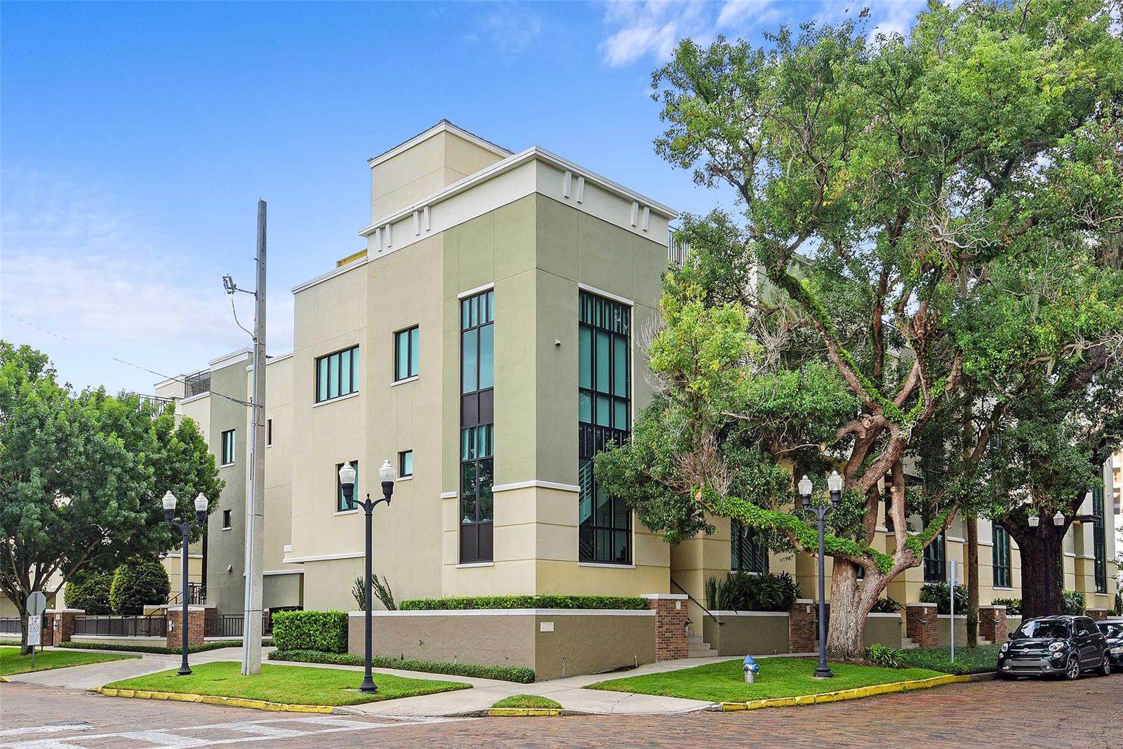 Don’t miss this unique opportunity. The Osceola Brownstones signified an important milestone in downtown Orlando’s residential renaissance and are rarely available. Located on the corner of E. Jackson and Osceola, just blocks from Lake Eola Park, the restaurants, bars & shopping of downtown and Thornton Park, the Dr. Phillips Center, the Amway Center and Orlando’s bustling business core, Unit #7 is THE premiere, corner brownstone residence. This beautifully maintained, light-filled condominium residence features 2 bedrooms, 2 full bathrooms and 1 half bath. Let’s talk convenience! From your attached two car garage you walk directly into your home. On the garage level you access your owner’s foyer/bonus room with plenty of room to store bikes, luggage and/or extra storage shelving. Connected by a grand central staircase, the space flows up to the main living area with large living/dining room, kitchen, powder room and balcony. Just a few steps higher and you access the bedroom level with large master suite, guest room and laundry.
Want to take a hot soak on a chilly night, or grill on a balmy Florida evening, just walk up the spiral staircase to your private roof deck and watch the stars, sparkling skyline or July 4th fireworks!
Be sure to check out the Pictures and Virtual Tour!
All measurements are approx. Buyer is responsible for verifying dimensions. This beautiful and lovingly maintained home is offered AS IS. ;Water: City