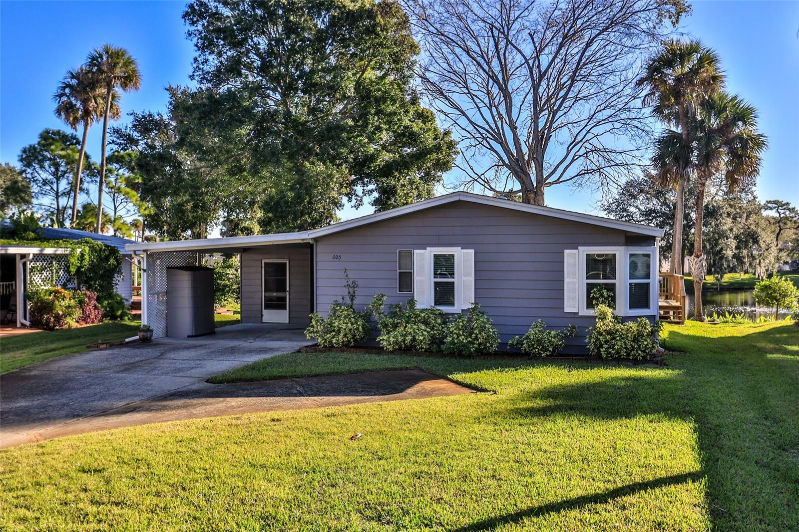 LAKEFRONT HOME.  Watch the ducks, birds and fish from your glassed in porch, living area and kitchen. Door going outside to the deck.   Kitchen has loads of cabinets along with a pantry.  Plenty of room for parking.  Walk in closets in the bedrooms.  Master bedroom has a bay window and one other window.  Master bath has two sinks and a vanity area. Family room could be a THIRD bedroom - windows, closet and window A/C.  Laundry room has lots of cabinets.  plumbing all repiped, double hung windows.  Roof 5/13, A/C 5/10 and water heater  6/2015.  Path to tennis court and heated pool is a short walk.  Boat launch is on the same street.  Edgewater Landing is an ACTIVE COMMUNITY and has won awards. You can store either a boat or RV (when there is room) at no charge.  HOA includes cable and internet.  Fitness room, pool tables, screen hot tub, intracoastal fishing pier, dance floor, bingo, ceramics -- the list goes on and on. RESORT LIVING EVERY DAY! ;Water: City