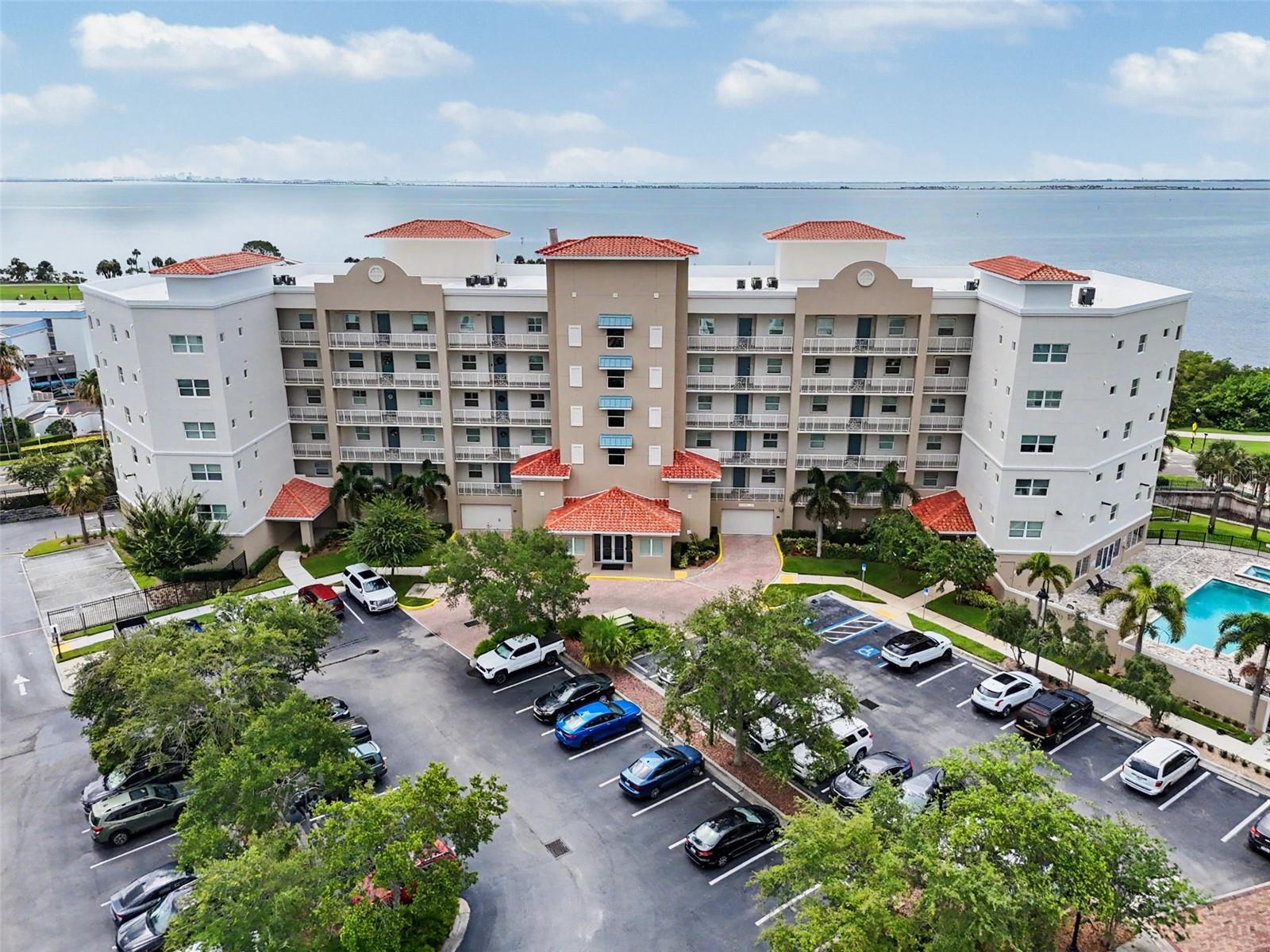 Welcome to one of Safety Harbor's most desirable condominium communities, a boutique community built in 2019 consisting of only 45 residences, with just 10 highly sought-after end units. This exceptional END-UNIT residence offers over 2,000 square feet of thoughtfully designed living space with 3 bedrooms, 2.5 bathrooms, and breathtaking panoramic views of Downtown Safety Harbor, Tampa Bay, the marina, pier, and Veterans Park.
The abundance of windows fills the home with natural light, creating a bright, open, and inviting atmosphere throughout. This RARELY AVAILABLE floor plan has been meticulously maintained and beautifully upgraded with plantation shutters on the windows, remote-controlled shades on the sliding glass doors, upgraded lighting fixtures, carefree tile flooring throughout the main living areas, and new carpeting in all bedrooms.
The spacious kitchen opens seamlessly to the living and dining areas, making it perfect for entertaining or simply enjoying the spectacular water and downtown views. Step outside onto your private balcony and experience one of Safety Harbor's most unique features—front-row seats to holiday celebrations, community parades, festive events, and fireworks right from the comfort of your own home.
The oversized primary suite provides a peaceful retreat with great views, while the generous secondary bedrooms provide flexibility for guests, family, or a home office. The large inside laundry room is an added bonus, complete with a utility sink and an additional refrigerator. Storage is plentiful throughout the residence, plus you'll appreciate the private storage closet conveniently located in the secured garage.
Additional features include TWO assigned under-building parking spaces with secured garage access, two elevators for added convenience, ample guest parking, and the confidence of fully funded condominium reserves.
Residents enjoy resort-style amenities including a heated swimming pool, hot tub, and fitness center. The community has also recently enhanced its curb appeal with freshly painted building exteriors and beautiful new landscaping.
Location truly sets this home apart. Situated just steps from charming Downtown Safety Harbor, you'll enjoy walking to award-winning restaurants, boutique shopping, coffee shops, community events, the world-renowned Safety Harbor Resort & Spa, waterfront parks, the marina, and the scenic walking and bicycling paths along Tampa Bay. Philippe Park is only minutes away, and Tampa International and St. Pete-Clearwater International Airports are easily accessible, making travel exceptionally convenient.
This is a rare opportunity to own one of the community's premier end-unit residences offering spectacular views, an exceptional floor plan, luxury amenities, and the unmatched Safety Harbor lifestyle.