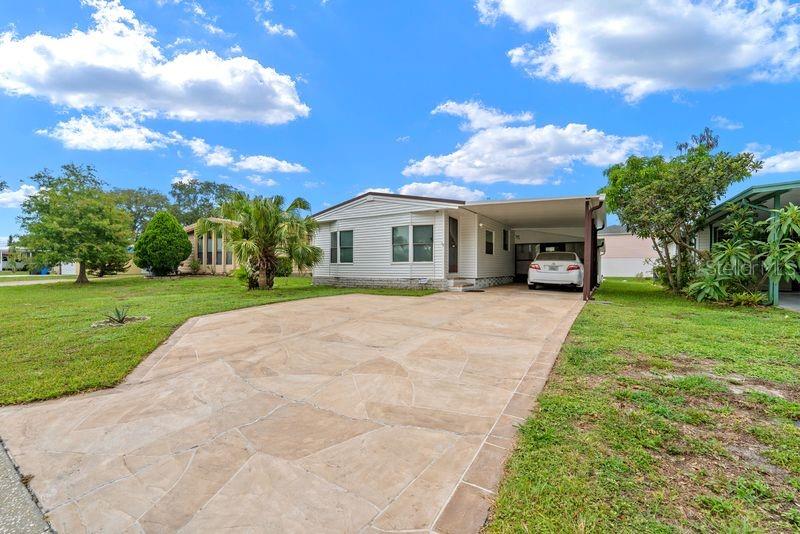 Welcome to your dream retirement oasis! This beautifully upgraded, fully furnished home offers the perfect blend of active living and modern comfort. PROPERTY HIGHLIGHTS: Land ownership: no lot rent—you own both the home and the land outright. Low HOA: enjoy premium community amenities without the hefty monthly fees. SAFETY FIRST: Located in a highly desirable, no flood zone for ultimate peace of mind. TURN KEY READY: This home is beautifully maintained and can be purchased furnished, if desired. It features a new A/C installed in 2025. INTERIOR FEATURES: Spacious layout: 2 bedrooms and 2 full bathrooms designed for comfortable living. The master bath has a walk-in shower, 2nd bath has a tub, the kitchen with ample storage space and an eat in area. ENTERTAINER'S DREAM: An open-concept living room, dining area, fireplace and kitchen layout. FLORIDA ROOM: A large, airconditioned, light-filled bonus space perfect for hosting large gatherings. EXTERIOR FEATURES Carport: gives you space for 2 small vehicles and a storage shed for tools and hobbies. Patio: Out back enjoy the outdoors with a large pave stone patio and watch the beautiful sunsets. RESORT-STYLE living nestled in the highly sought-after SHELDON WEST community. This vibrant 55+ neighborhood is both pet-friendly and golf-cart friendly. The home is just a short, scenic walk from the heart of the community's activities. AMENITIES INCLUDE: sparkling oversized community pool, active clubhouse and shuffleboard courts, private community dock overlooking the lake—perfect for sunset viewing. PRIME LOCATION: situated on the edge of the renowned WESTCHASE AND CITRUS PARK areas, and you are just minutes away from top-tier shopping, premier dining, local entertainment, and major medical centers and more.

 Property information is provided for reference only and is not guaranteed. buyer is responsible for verifying all data.