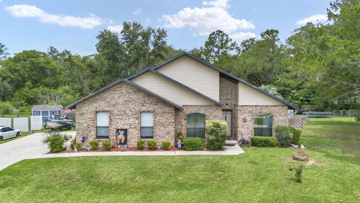 Welcome to this beautifully updated pool home in the highly sought-after Wineberry neighborhood of Southeast Ocala! Nestled on a private, oversized lot that backs up to peaceful greenspace, this spacious 3-bedroom, 3-bathroom residence offers approximately 1,972 square feet of comfortable living space and seamless indoor-outdoor Florida living. Step inside to an open, inviting floor plan where the large custom kitchen with granite countertops and ample cabinetry flows effortlessly into the eat-in kitchen area and the formal dining room. Both open directly to the spacious living room, creating the perfect setting for everyday living and entertaining. The primary suite is a true retreat, featuring French doors that open to the pool area and a recently updated primary bathroom. Two additional generous bedrooms and a second full bath provide comfort for family or guests. A highlight of this home is the convenient third bathroom located directly off the heated saltwater pool — perfect for poolside convenience and easy outdoor entertaining. Recent updates include a newer HVAC system, ensuring year-round comfort and efficiency. Outside, enjoy your private backyard oasis with a sparkling heated saltwater pool surrounded by lush landscaping. The oversized lot that backs to greenspace offers maximum privacy and feels like your own personal resort. Additional convenience comes from the detached oversized 2-car garage, providing excellent extra parking and storage space.