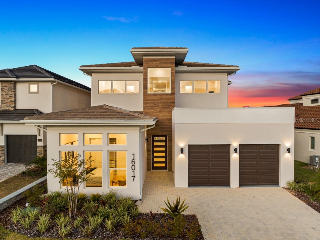 New move in ready home overlooking the Nick Faldo designed golf course and rolling hills of Montverde in the gated community of Bella Collina. The modern flare of this home and open ceiling to the second floor reflect clean lines and allow for plenty of natural light throughout. The kitchen with large island overlooks the great room featuring Samsung appliances, 5 burner gas range, built in wall microwave and oven with an abundance of surrounding cabinetry. The 10 ft sliding doors open to an oversized lanai with double remote controlled screens with a built in movie screen to be able to watch movies poolside, an outdoor kitchen and beverage fridge making it perfect for entertaining family and friends. There is a first floor dedicated office in addition to an in-law suite with sitting area that can also serve as two separate bedrooms if needed. The second floor offers the laundry room, two extra ensuite bedrooms and the master with a private balcony overlooking the golf course.  Bella Collina offers year round social and culinary events for owners. Amenities include 2 restaurants with indoor and patio dining, spa, fitness center with complimentary fitness classes, outdoor pool complex, pickle ball and tennis courts. Call today to preview and learn more about the lifestyle offered in Bella Collina.