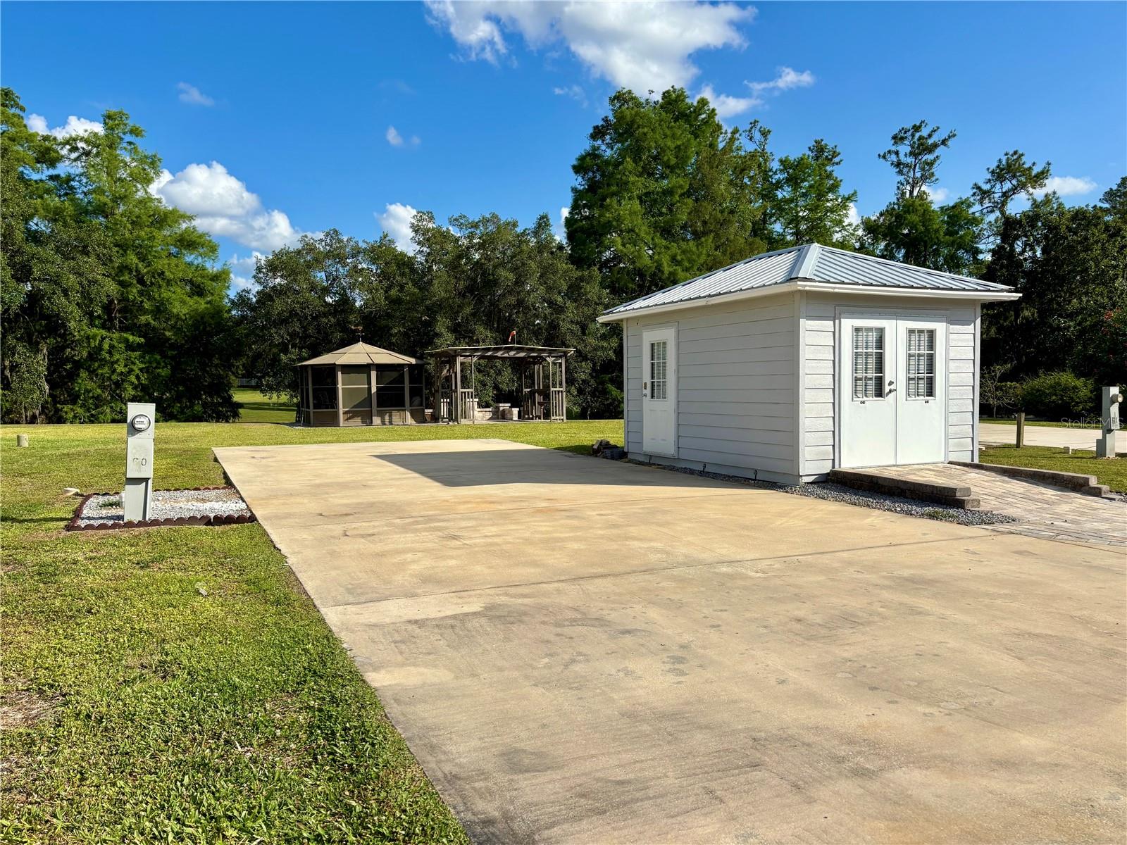 Serene RV Lot in 55+ Wilderness Preserve Estates
Near Ocala, FL!! You Own the Land!! Nature Lover’s Paradise!!

Welcome to your own piece of paradise in the highly sought-after 55+ community of Wilderness Preserve Estates. This spacious double gated deeded RV lot offers privacy, tranquility, and all the amenities you need for the perfect Florida lifestyle.

The lot is generously sized with mature landscaping and green space behind the lot, creating a peaceful and private atmosphere. A large paver patio provides the perfect setting for outdoor entertaining or simply relaxing in the warm Florida sunshine. A screened gazebo offers a comfortable space to enjoy the evenings, and an on-site storage shed adds valuable convenience. The lot backs up to a scenic, tree-lined retention pond, adding to the sense of seclusion and natural beauty.

Outdoor enthusiasts will love being just a short stroll from the Ocklawaha River, ideal for kayaking and fishing. The property also offers direct access to the extensive Greenway hiking trails, perfect for daily walks or wildlife spotting.

Community amenities include a clubhouse for social gatherings, a heated pool and hot tub for year-round relaxation, a fitness center, and shuffleboard courts. The HOA fee covers lawn care, water, sewer, trash, and road maintenance, making for easy, carefree living.

Located just minutes from Silver Springs State Park, shopping, restaurants, and historic downtown Ocala, this property also offers convenient access to Ormond Beach—only about an hour away.

Don’t miss this rare opportunity to own land in a peaceful, nature-filled 55+ community.