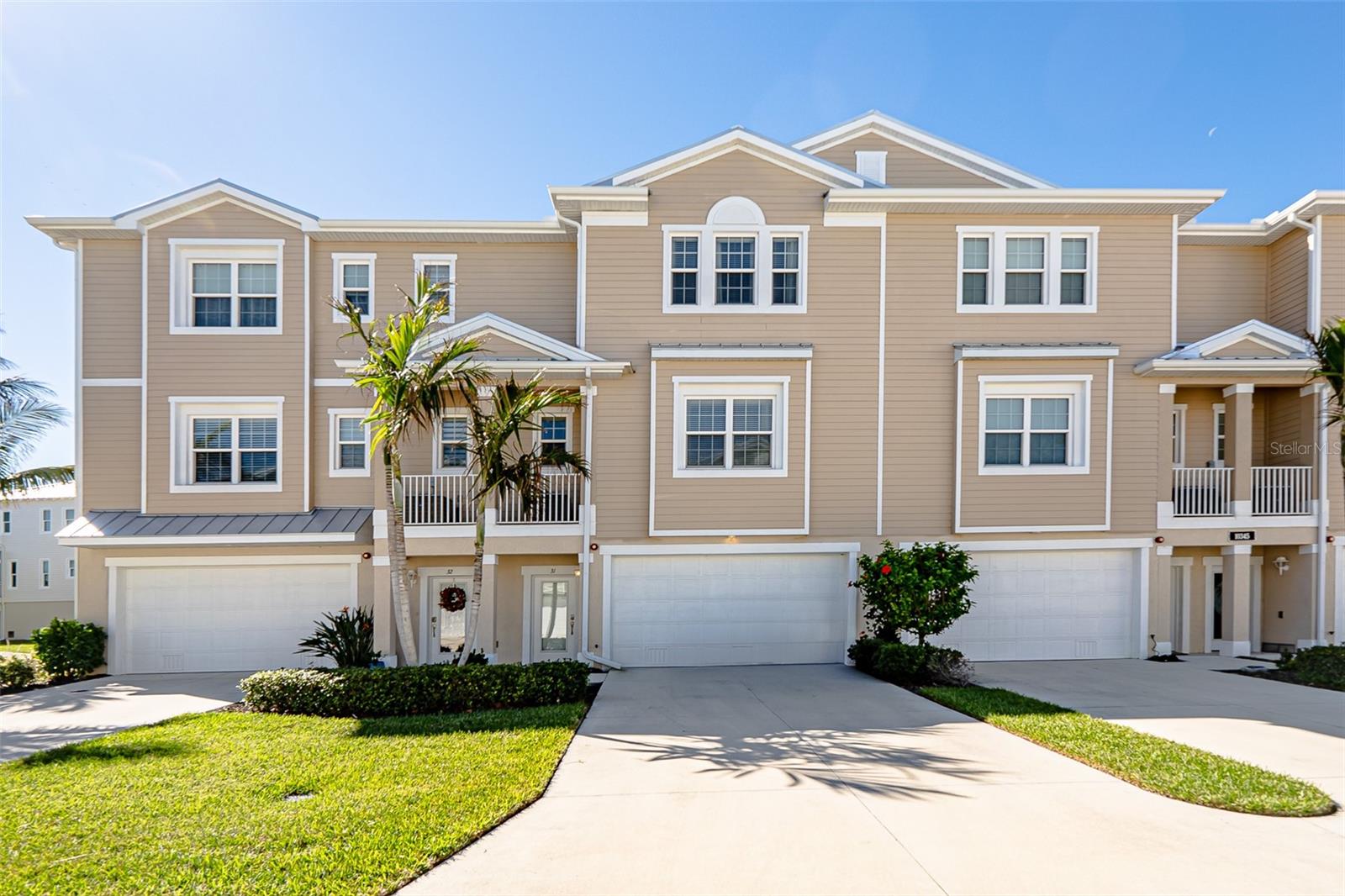 Coastal Luxury Meets Blissful Waterfront Serenity and Privacy. Experience the best of coastal living in this 2020-built WATERFRONT luxury townhome offering 2,416 sq. ft. of refined living space (TURNKEY FURNISHED) with unmatched, undisturbed panoramic water views. From your private balcony and the serene master suite, take in enchanting views of dolphins, manatees and graceful white pelicans that call Coral Creek home - or cast a fishing line from the community fishing pier and reel in snook or redfish practically at your doorstep! Designed for both elegance and durability with a base elevation of 11ft, this fortress-style home is constructed of solid block with impact-resistant glass windows and a metal roof, ensuring peace of mind in any storm. Featuring 4 spacious en-suite bedrooms complete with full bathrooms, a rare 4-car garage with storage, and the convenience of a private whole-home elevator... this residence was created for both comfort and lifestyle. Nestled along the pristine waters of Coral Creek Intracoastal Waterway, you’ll enjoy tranquil sunrise views over the water with a protected nature preserve just beyond, while enjoying visits from dolphin, manatee and a plethora of coastal birds that frequent this area. The Boca Grande Causeway, world-class dining, boutique shops, golf, marinas, and some of Southwest Florida’s most beautiful beaches are only minutes away. Inside, the second floor welcomes you with soaring ceilings, custom plantation shutters, upscale lighting, and a bright, open living area framed by breathtaking water views. The gourmet kitchen features granite countertops, modern appliances, a walk-in pantry, and a spacious breakfast bar. Step onto the screened balcony to soak in the serenity of the surrounding waters and wildlife. On the top level, the primary suite is a true retreat—wake up to the sunrise over the water, relax under tray ceilings, and indulge in a spa-like bath with dual vanities, walk-in shower, private commode and a soaking tub with spectacular views. A second suite on this level offers the same sense of luxury and privacy. The community offers resort-style amenities including a massive pool with lake views, fitness center, tennis and pickleball courts, kayak launch, fishing dock, and a stunning clubhouse with tropical landscaped gathering spaces. Low-maintenance living is ensured with HOA coverage that includes exterior insurance, landscaping, and upkeep. Additional highlights: No flooding from Hurricanes Helene or Milton (per seller) Screened ground-level patio Steps to the community dock and kayak launch This property is more than a home—it’s a lifestyle. Elevate your coastal living at The Landings at Coral Creek—the gateway to Boca Grande.