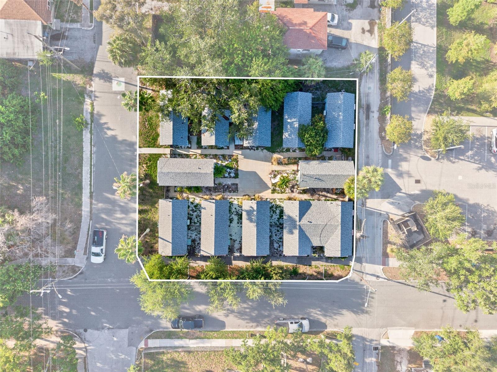 Positioned in one of St. Petersburg’s most compelling growth corridors, 421 15th Ave S presents a rare multifamily development opportunity in the direct path of progress—strategically located between the thriving Innovation District and the rapidly transforming Old Southeast, with the transformative Tropicana redevelopment continuing to fuel momentum throughout the surrounding area. This is the type of boutique urban infill opportunity developers and multifamily investors actively seek: a thoughtfully designed project with a clearly defined entitlement pathway in one of Tampa Bay’s fastest-evolving submarkets. The property is being offered as site plan approved and includes the land, architectural plans, renderings, and survey documentation for a proposed 11-unit courtyard-style apartment community. While future entitlements, permitting, and final approvals are not guaranteed and remain subject to buyer diligence and municipal approval processes, the project has already achieved meaningful progress through the development process, substantially reducing early-stage planning hurdles for the next owner. For qualified buyers seeking to further accelerate the timeline to construction, the seller may deliver the project fully entitled, permit-ready, and shovel-ready for an additional fee, creating a rare opportunity to acquire a boutique multifamily development with significant pre-development work already completed. The proposed unit mix has been intentionally designed to meet growing demand for efficient, design-forward urban housing, featuring 4 studio units (~317 SF average), 4 one-bedroom units (~404 SF average), and 3 two-bedroom units (~714 SF average). The concept targets strong demand from young professionals, workforce housing tenants, medical district employees, and renters seeking proximity to Downtown St. Petersburg, the waterfront, and major employment centers. Architecturally, the project embraces a modern Spanish ranch aesthetic blending timeless character with contemporary livability—highlighted by stucco exterior finishes, metal roof elements, private balconies, abundant natural light, and a thoughtfully designed landscaped courtyard intended to foster community interaction and enhance tenant experience. The overall design prioritizes efficient layouts, shared outdoor spaces, and strong curb appeal, creating a highly attractive boutique multifamily product for this rapidly appreciating corridor. As developable land opportunities continue to diminish throughout St. Petersburg and entitlement timelines become increasingly challenging, projects with meaningful progress already achieved are becoming exceptionally scarce. Pricing reflects the project’s current approval status, while offering substantial upside potential tied to future entitlement progression, permitting milestones, and continued neighborhood growth driven by significant public and private investment nearby. Whether envisioned as a long-term hold for stabilized cash flow, a boutique multifamily showcase asset, or a strategic build-to-sell opportunity, 421 15th Ave S represents a compelling acquisition opportunity in one of the city’s highest-upside redevelopment corridors.