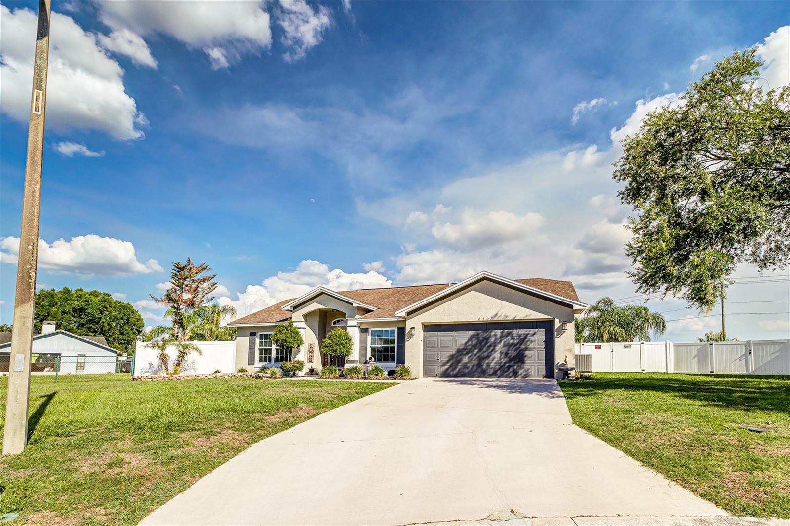 Welcome to 6507 Fox Tree Lane, a South Lakeland pool home offering spacious living areas, thoughtful updates, and a backyard built for Florida living. Inside, the home features wood-look ceramic tile flooring throughout the main living areas and bedrooms, creating a clean, cohesive, and low-maintenance feel. The floor plan includes a front sitting room, separate dining space, comfortable main living room with recessed lighting, and a well-appointed kitchen with cabinetry, granite countertops, stainless steel appliances, breakfast bar/pass-through, and additional built-in storage.

The primary suite offers generous space, a walk-in closet with built-in storage, and an updated en-suite bathroom featuring dual vessel sinks, a long vanity, and a walk-in shower. Additional bedrooms provide flexibility for family, guests, or a home office, while the spare bathroom includes a jacuzzi tub for added comfort.

Step outside to enjoy a screened lanai with a sparkling pool, paver deck, covered seating area, and plenty of room for outdoor dining, lounging, and entertaining. Beyond the pool area, the fully fenced backyard offers tropical landscaping, palm trees, and a large open lawn.

Major updates include HVAC and windows in 2020, dishwasher, refrigerator, stove, and microwave in 2022, and a tankless water heater in 2026. The washer and dryer are also included, adding everyday convenience. Complete with a two-car garage and interior laundry room, this home blends comfort, function, and everyday Florida lifestyle in a desirable Lakeland location.