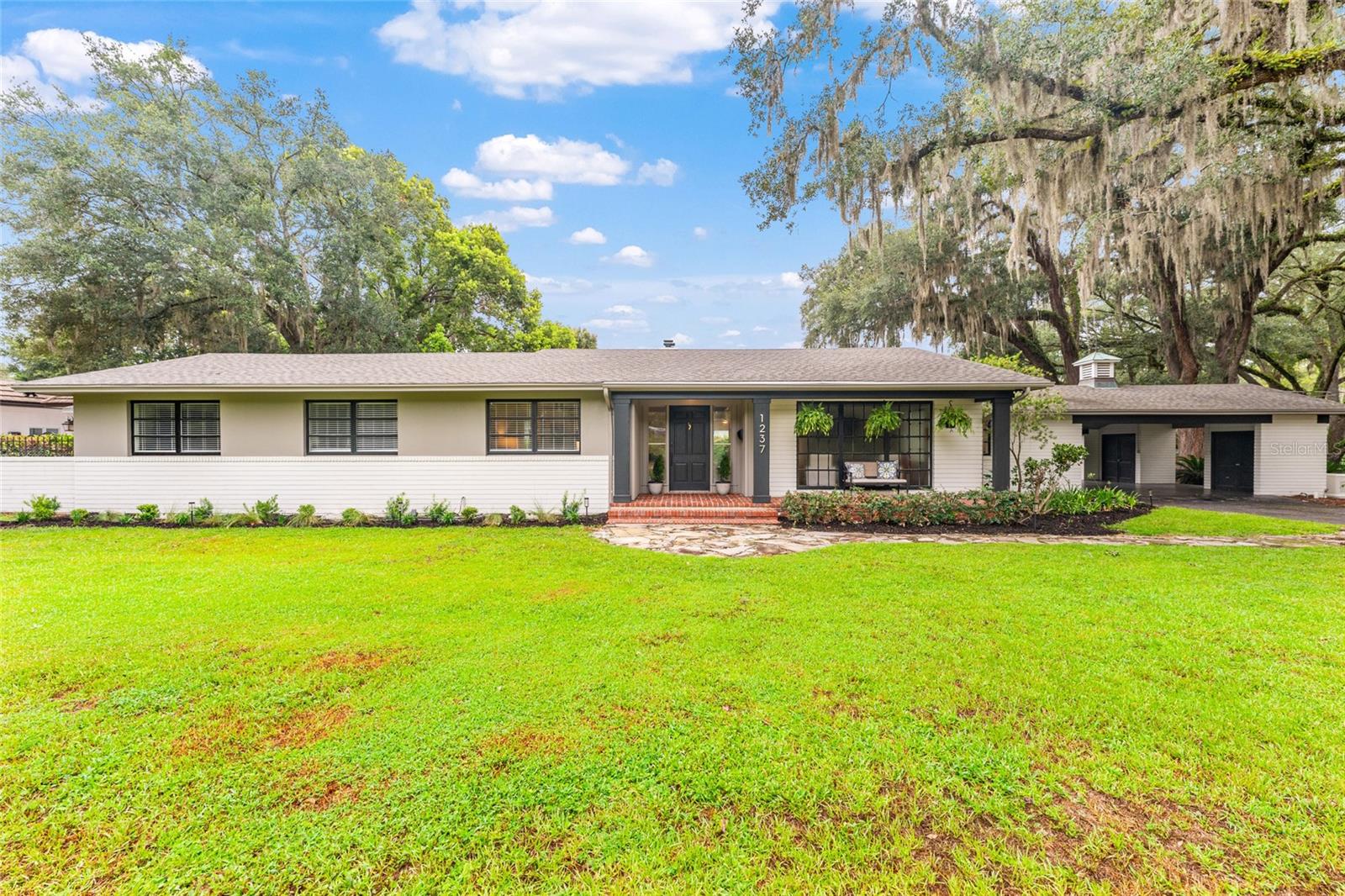 Rare Woodfields Historic District Gem — Fully Renovated 3 Bedroom, 2.5 Bath Pool Home on Nearly Half an Acre!

Welcome to this exceptional corner-lot residence in the highly sought-after, golf cart-friendly Woodfields Historic District. This beautifully renovated 3-bedroom, 2.5-bath pool home seamlessly blends timeless charm with modern luxury and thoughtful upgrades throughout.

The heart of the home is a stunning custom-designed kitchen featuring abundant custom cabinetry, a professional-grade 8-burner gas range with double ovens, a built-in wet bar complete with wine refrigerator and ice maker, and a pantry. Gorgeous wood flooring flows throughout the home, complemented by floor-to-ceiling dining room windows that provide views of the pool and surrounding landscape.

The home offers a beautifully updated gas fireplace located in the spacious dining room and sitting area, two fully renovated bathrooms in 2026 including the master ensuite, a dedicated in-home laundry room, and exceptional storage with abundant closet space—including a walk-in master bedroom closet. Custom built-ins and unique architectural details can be found throughout the residence, adding both character and functionality.

Major systems have been thoughtfully updated, including electrical service and wiring, plumbing and drain lines, a new roof installed in 2019, a tankless gas water heater, updated pool/kitchen half bath, and upgraded pool equipment including a new pump and filter. The exterior was freshly re-painted 3 years ago, enhancing the home’s timeless curb appeal.

Situated on a picturesque corner lot of nearly half an acre, the property features beautiful mature live oaks, a private pool, and a peaceful setting within one of Ocala’s most desirable historic neighborhoods.

Conveniently located within walking distance to both 8th Street Elementary and Osceola Middle schools and is also zoned for Forest High School. This extraordinary move-in-ready home offers the perfect combination of historic charm, modern upgrades, and an unbeatable location. Schedule your private showing today and experience all that this Woodfields treasure has to offer!