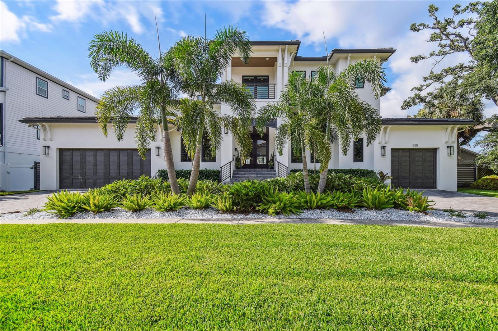 Under contract-accepting backup offers. THIS is your Davis Islands dream home! Beautifully positioned on over 100’ of coveted water
frontage and exquisitely designed with incredible attention to detail, this modern coastal home
was custom-built using the highest quality materials and luxurious finishes.
Through the contemporary 8’ custom mahogany and glass front door, natural light fills the
home as the entryway leads beyond a formal dining room and an elegant office, opening into
the bright and airy living space and expansive kitchen. A refrigerated wine cellar with stainless
steel racks, floor-to-ceiling wood tiling, marble flooring, and solid mahogany door with
electronic lock, is showcased through its glass viewing panel as you enter the perfect
entertaining kitchen.
Marble counters &amp; backsplash, an extra-large island with Shaw apron sink, and appliances
including Sub-Zero refrigerator, Wolf gas range with griddle, Wolf microwave drawer, and
Bosch dishwasher, a butler’s pantry and a full walk-in pantry for additional storage make this
kitchen a dream for hosting family and friends! The adjoining family room features a linear gas
fireplace and marble surround, custom built-ins, and beautiful coffered ceiling. The wall of
sliding glass windows – all impact-resistant of course, fully open to bring the outside in as you
step onto the covered lanai with a gas fireplace and outdoor kitchen including a Blaze grill and
smoker, double hood, concrete counters and sink, and beverage center, and out to the
contemporary salt-water pool and spa. Beyond the pool and the new seawall, a fully-equipped
composite dock features a covered 13,500-lb boat lift (plus an additional electric lift and lower
feature to ease in and out of the water), AND a 1,500-lb kayak lift.

Back inside, the first floor is complete with a guest bedroom with its own full bathroom, a huge
laundry room with sink and custom cabinetry, a powder room - and of course, the massive
primary suite – a sanctuary featuring two walk-in closets, and chic ensuite bathroom with
imported Italian honed marble shower, marble flooring and counters, and a solid-surface
freestanding soaking tub. On the second floor, you will find a second office, a huge bonus room
- with its own full bathroom and closet, this could easily become a 5 th bedroom suite! - and two
additional bedrooms with their own walk-in closets and full bathrooms with marble counters
and flooring. Exterior features include two separate garages with ample space for storage and
equipment, parking for three full-sized vehicles and bonus garage parking space for a golf cart,
which can be used to cruise all of Davis Islands including the Village restaurants and shops, over
to one of the islands’ parks and more! The fantastic neighborhood, quiet but friendly streets,
and close proximity to downtown and major attractions make it one of the hottest markets in
town! Schedule a private showing to see and experience this stunning home today.