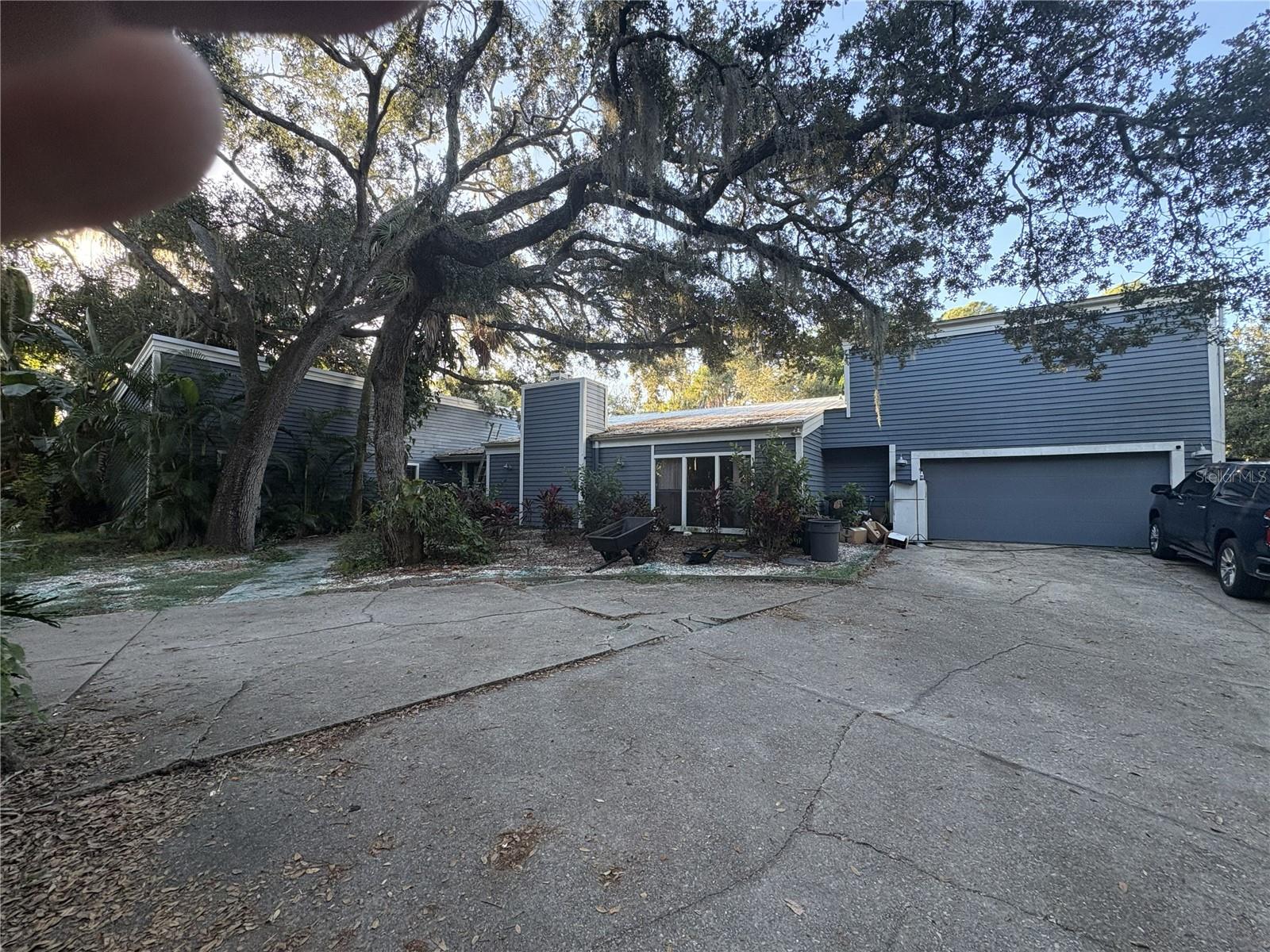 Nestled among mature trees, this home offers incredible potential to become your dream residence with some exterior updates and TLC. Situated on 2.3 acres in the highly desirable Fox Fire West, east of I-75 in Sarasota County, this property truly delivers on location, location, location.

Located in a quiet cul-de-sac, the neighborhood features homes starting at $1.1M+. Enjoy the best of both worlds—country-style living while remaining close to everything. Home Depot, Publix, and Walmart are just 5 minutes away, and UTC Mall is only a 15-minute drive.

The home features two fireplaces—one in the living room and one in the primary bedroom. The spacious primary suite includes three closets, a large walk-in shower, and a private two-level enclosed sauna. Sliding doors lead directly to the pool, with an additional set opening into a dedicated Jacuzzi room.

Two bedrooms share a Jack-and-Jill bathroom, while a separate upstairs bedroom includes two walk-in closets, its own bathroom, and a private exterior entrance—ideal for an older child, guests, or a private retreat.

Living and dining areas are an open-concept layout, complemented by an additional formal dining room. Three pocketing sliding glass doors open to an oversized covered pool and lanai with an eat-in area. Beyond the pool, a roofed gazebo with three wired ceiling fans provides the perfect outdoor gathering space.

Once you experience this home and envision the possibilities with thoughtful updates or renovation, you’ll immediately see the exceptional value and potential it offers.