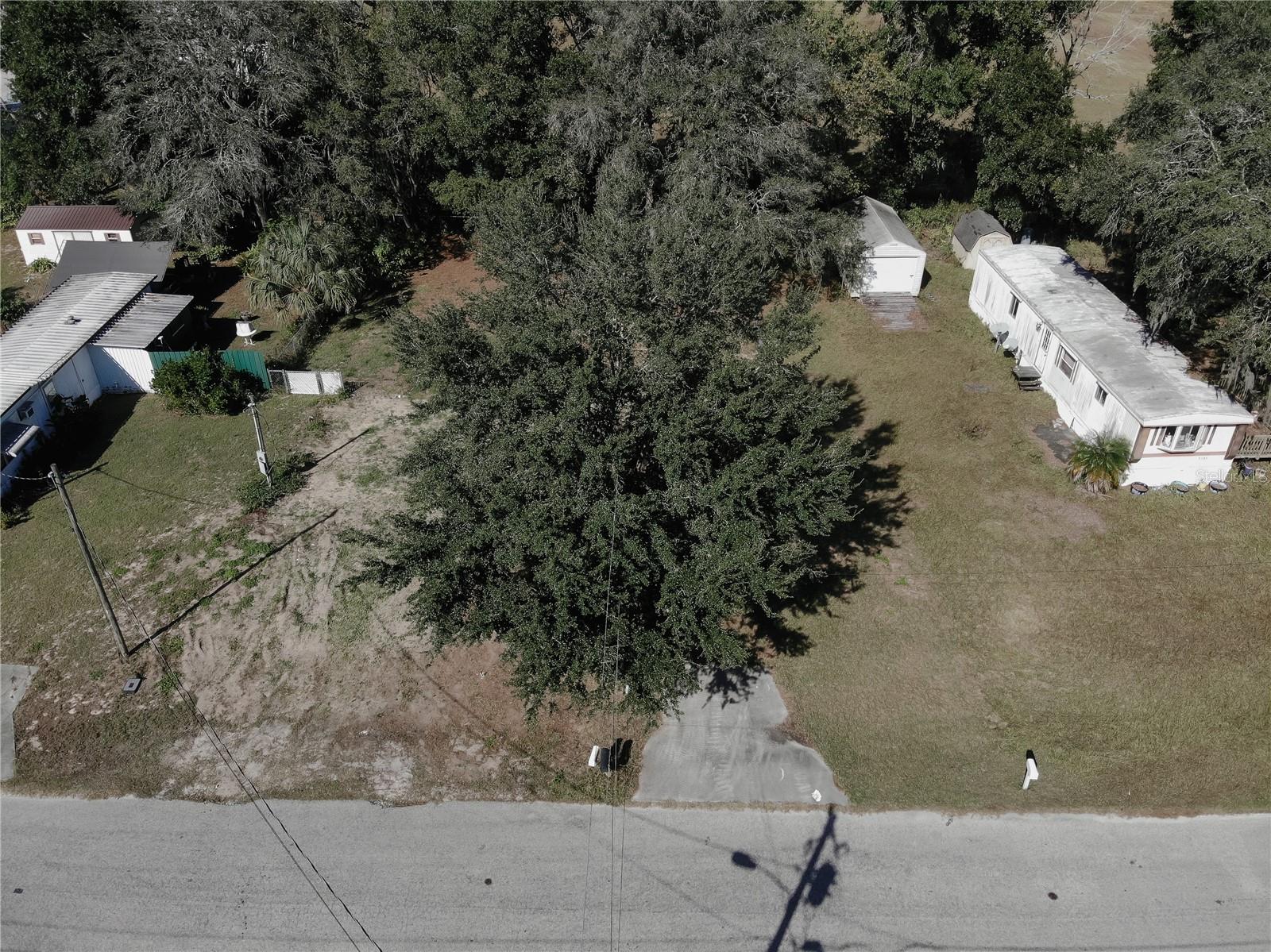 Looking for freedom and flexibility near The Villages? This ready-to-build property is your opportunity to create the Florida lifestyle you’ve been dreaming of—without HOA or CDD limits. The lot is cleared, fenced, and already equipped with a well, septic, and electric hook-up. Plus, no impact fees for almost two more years means more savings to put toward your design. Whether you’re an investor or future homeowner, this is where your next chapter begins.