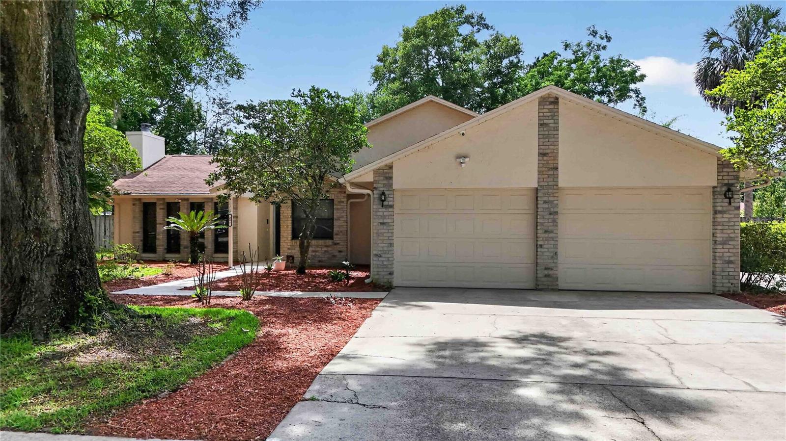 Welcome home! Nestled on a beautiful lot shaded by majestic mature trees, this stunning custom built 3-bedroom, 2-bathroom, 1,645 sq ft (with an extra 200sq ft sun room under air) residence offers the ultimate blend of classic character and sleek, modern updates. With no HOA restrictions, you have the freedom to truly make this property your own—including a dedicated parking pad for your boat or RV and concrete pad with overhang in the back yard. Located close to SR453 and SR429 for easy access to Orlando. 

Step inside to find a freshly painted interior and newly polished stylish flooring that flows seamlessly throughout. The heart of the home features a beautiful kitchen with  stunning Silestone countertops known for their durability and low maintenance, and a cozy eat-in area, plus a separate formal dining room perfect for hosting holiday dinners. Unwind in the spacious family room anchored by a gorgeous wood-burning fireplace, ideal for crisp Florida evenings.

The primary suite is a true sanctuary, boasting a completely renovated en-suite bathroom and elegant French doors that open directly into an enclosed, fully air-conditioned sun room. This versatile sunroom expands your living space and overlooks a massive, fully fenced backyard—a private oasis for pets, play, or future outdoor projects and plenty of room for a pool.  Roof 2018.  Water Heater Nov. 2024. A/C unit 2013

Complete with a two-car oversized garage and located just minutes from top-rated schools and the historic charm of downtown Mount Dora’s shopping, dining, and festivals, this 1987-built beauty is completely move-in ready. Schedule your private showing today before it’s gone!
Some photos virtually staged.

Zoned for Triangle Elementary.  Round Lake Elementary Charter School also available