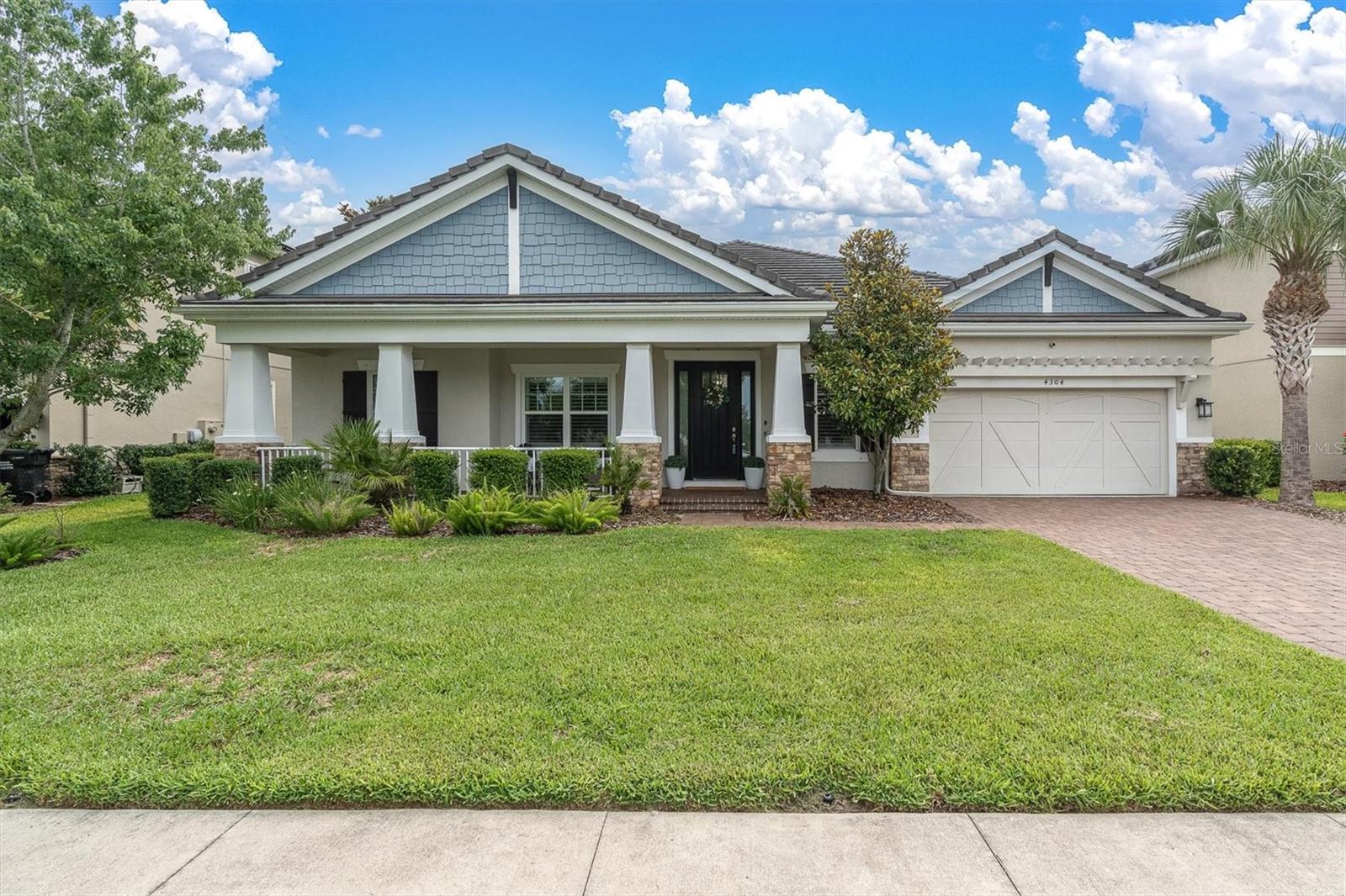 WELCOME TO THIS IMMACULATE, ONE STORY POOL & SPA HOME ON CONSERVATION IN DESIRABLE STARKEY RANCH! This move-in ready Taylor Morrison Abaco offering 4brs, 3.5 ba, 3 car tandem garage plus office & bonus room situated on a fully fenced, oversized conservation lot with heated pool & spa is the perfect blend of elegance, comfort & functionality. Nestled on a premium .32 Acre homesite with beautiful conservation views, this thoughtfully designed residence showcases exceptional curb appeal with a welcoming front porch, stone accents, manicured landscaping, and a spacious 3-car TANDEM garage. Step inside to discover a bright, one story open-concept floor plan enhanced by soaring tray ceilings, decorative wood beams, designer lighting, neutral finishes, a consistent wood look tile throughout main living areas and abundant natural light. As you enter the foyer, to the right is a formal dining room with tray ceiling & chandelier and to the left is a dedicated office with French doors providing an ideal work-from-home space.  The expansive great room serves as the heart of the home enhanced by wood beams and custom built in with storage cabinets, decorative floating shelves, stone accent wall & fireplace. The main living, dining, and kitchen spaces are seamlessly connected—perfect for both everyday living and entertaining with views of the tranquil trees. The impressive gourmet kitchen is beautifully appointed with Snowbound White Shaker cabinetry, complimentary quartz countertops, stainless steel appliances, a gas cooktop with custom hood, built-in wall oven and microwave, stylish backsplash, oversized island with seating, and generous storage throughout. A casual dining area adjacent to kitchen is highlighted by chandelier and board & batten accent wall. A convenient powder room is located close by. The spacious primary retreat features tray ceilings, large windows with views of the conservation, and a luxurious ensuite bath complete with dual vanities, soaking tub, oversized walk-in shower, and an expansive walk-in closet. The split-bedroom layout offers privacy for family and guests with br 2 adjacent to the full bath and bonus room. Additional bedrooms are generously sized, and full bathroom offers convenience and flexibility for family and visitors alike. A well-equipped laundry room provides extra storage and functionality. Step outside to the covered and panoramic screened lanai where you can relax, dine, or entertain while enjoying peaceful outdoor living and private backyard views with a fully fenced yard. The centerpiece of the outdoor space is the heated saltwater pool & spa with an abundance of cool Shellac paver deck space to enjoy. With its thoughtful design, upscale finishes, and desirable layout, this home truly offers the best of Florida living. Conveniently located near Starkey K8 Magnet School, community amenities, parks, walking trails, shopping, Publix, dining, and a short commute to Tampa Airport & Beaches, this exceptional home is ready to impress even the most discerning buyer. By Appointment only.