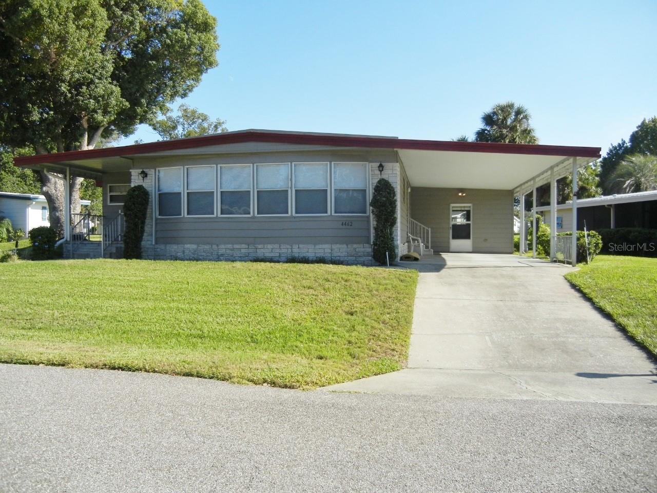Nice open floor plan with lots of space. Wonderful, updated kitchen tile backsplash, recessed lights, glass top range, Refrigerator replaced November 2021. Updated vinyl plank flooring throughout, carpet only on porches, Fresh paint in both bathrooms, Master bath has two closets one is a walk in, updated tile shower. Coat closet in the hall and a pantry in kitchen nook. Two porches one with vinyl windows and a closet the other has sliding windows. Bonus room off the living room with tile floor, looks like someone used it as their office. Lots of storage No rear neighbors, Ac replaced in April 2022, replumbed Feb 2022, Electrical meter, and breaker box replace in Aug 2022, new screens all around. Don’t wait long, call and make an appointment today! This will not last long in beautiful Zellwood Station you own the land and it’s not a co-op but considered a condo as far as land ownership.