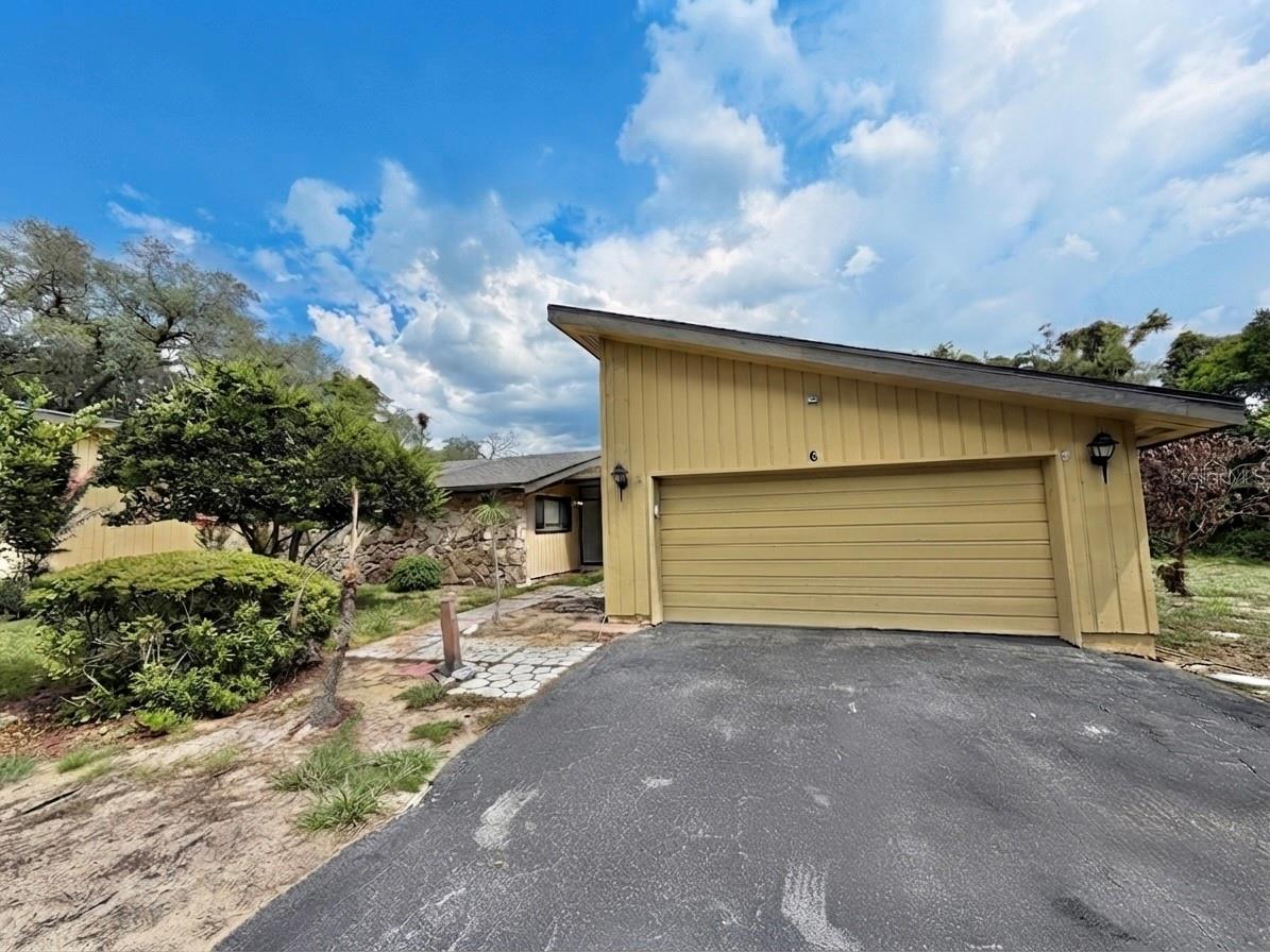 Nestled in Haines City, Florida — proudly known as the Heart of Florida-- this beautifully
maintained one story 2-bedroom and 2-bathroom townhome offers 2,005 square feet of heated living space on an
impressive, oversized lot of 0.57 acres. Step inside and you'll immediately be greeted by a
well-appointed kitchen featuring solid wood cabinets and stunning granite countertops — the perfect
space for everyday cooking and entertaining. Moving further into the home, the dining room opens
naturally into the spacious living room that is anchored by a cozy fireplace.  The two spaces flow
together to create an open common area with soaring vaulted ceilings that give the home
an expansive, airy feel. From the living room, sliding glass doors lead directly to a generous
enclosed rear porch. The primary bedroom has vaulted ceilings with a skylight that directs natural light into the room. Fresh interior paint and beautiful ceramic tile and laminate flooring throughout the home tie the entire space together. This community is gated. Just 6.3 miles from U.S. 27, you have Tampa Bay, Winter Haven, Orlando, Disney, Universal Studios, and so much more within arm's reach! Call for your appointment today!