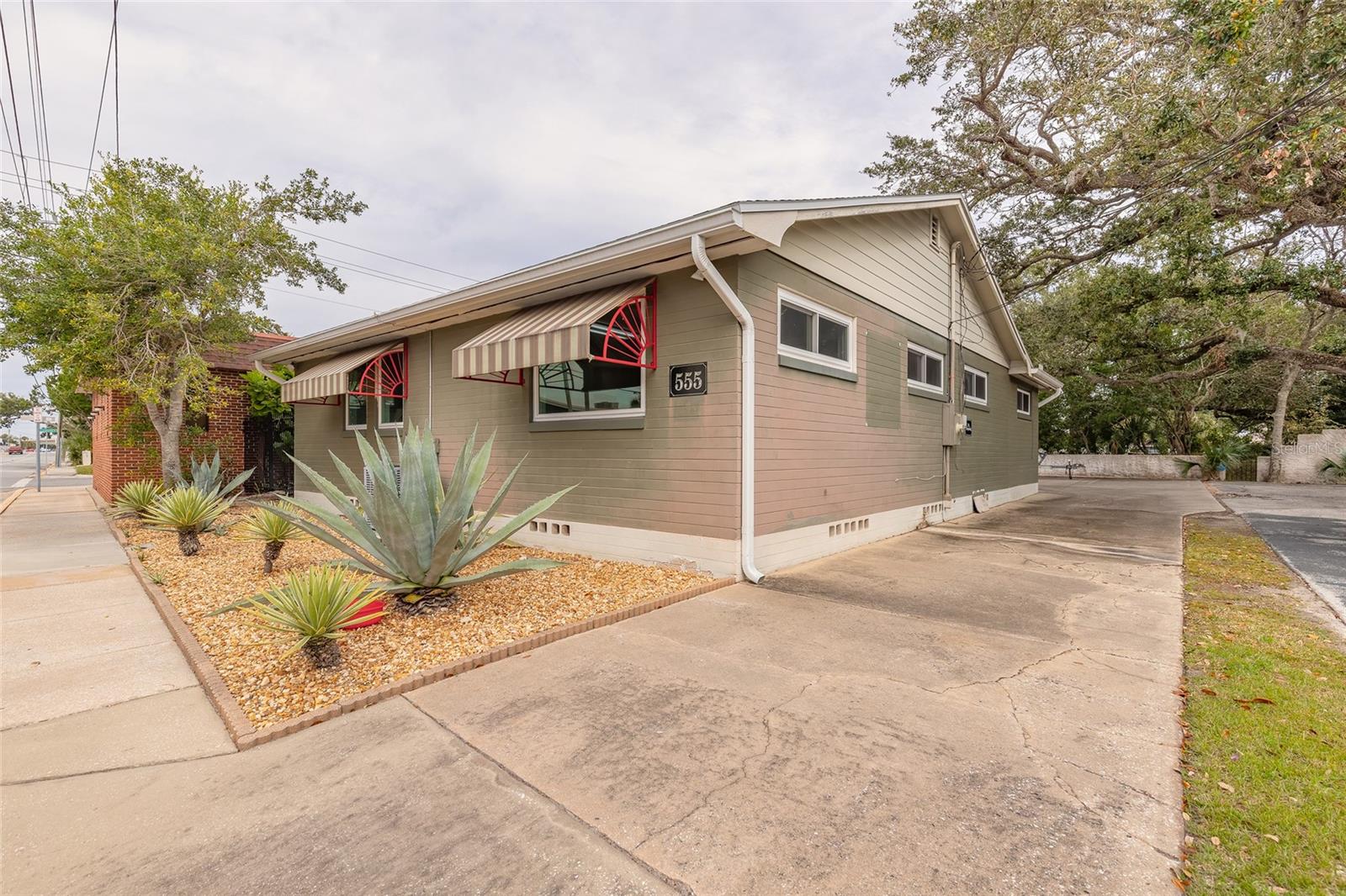 Exceptional commercial opportunity ideal for a small business or professional office. This 1,721 SF solid block construction building has been thoughtfully updated with a newer roof, updated windows, and HVAC, providing efficiency and peace of mind. The interior can accommodate up to five private offices with a reception area, along with a full bathroom, kitchen, stackable washer and dryer, and tankless water heater, making it well-suited for owner-users or tenants seeking turnkey functionality. The property features rear parking and is located in a central, high-demand area within the Ballough Redevelopment Zone, qualifying for business incentives such as grants, zero-interest loans, tenant build-out and lease subsidies, and up to $50,000 in forgivable loans for commercial upgrades. Strategically positioned just 2/10 mile from I-400 North, the site is surrounded by major redevelopment including a new 6-story residential community with apartments and amenities, Brown & Brown's prominent headquarters, and the Riverfront Esplanade. With close proximity to three bridges, Main Street, International Speedway Boulevard, and Seabreeze, the property offers easy access to both beachside and mainland areas. An added advantage is its ability to pair seamlessly with the adjacent building currently for sale, creating an excellent opportunity for expansion or a multi-building business campus in a rapidly evolving corridor.