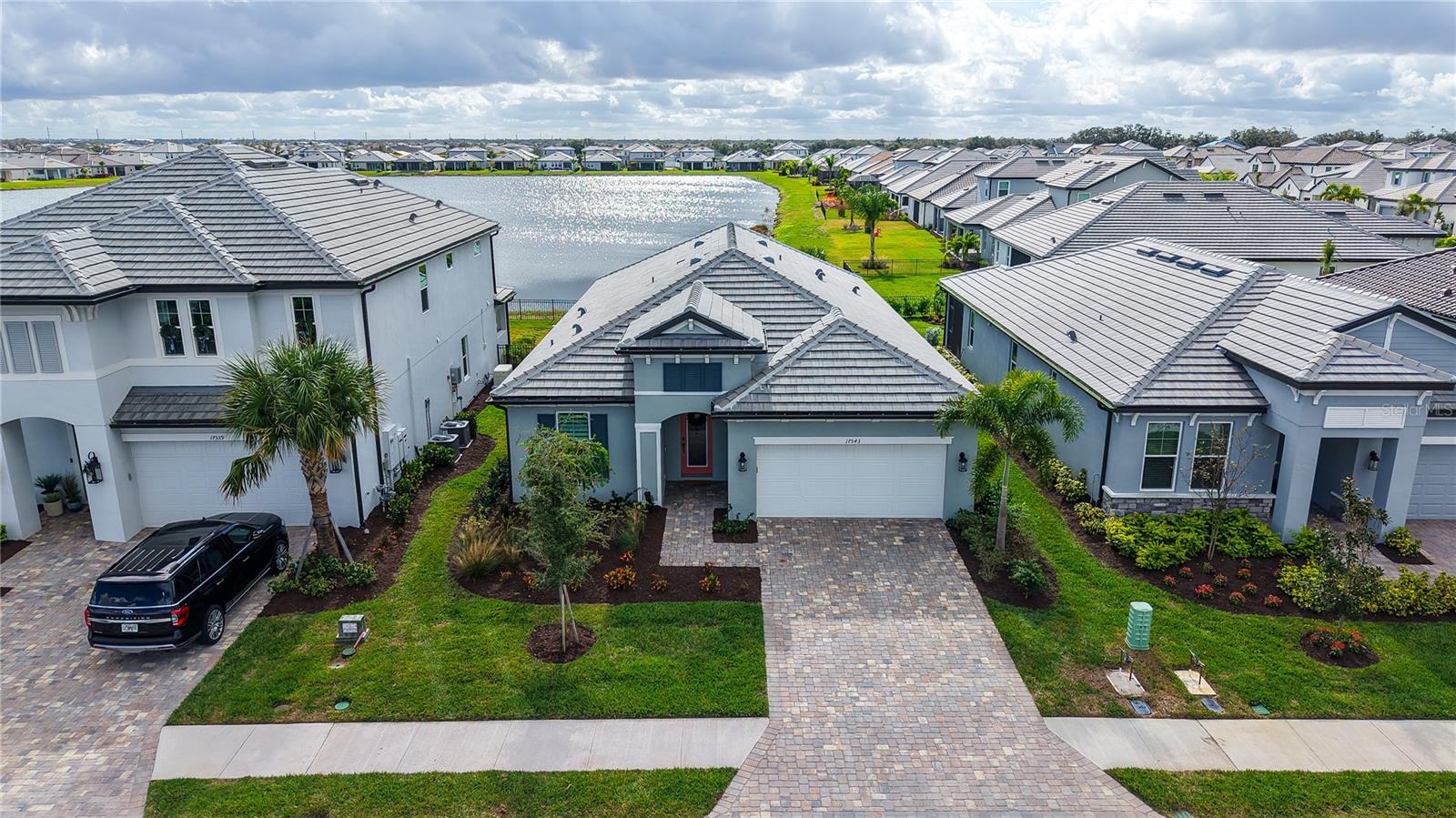BIG PRICE REDUCTION!!
Exceptional value on a premier lakefront lot in Sweetwater at Lakewood Ranch—with the lot premium already paid and extensive upgrades throughout. This is a home you will truly love to call your own.

Perfectly positioned on one of the community’s most desirable lakefront homesites, this like-new 3-bedroom, 2.5-bath residence offers serene lake views and stunning golden sunrise reflections. With approximately $146,000 in premium upgrades, the home features upgraded flooring, designer kitchen and bath selections, modern finishes, and thoughtfully designed living spaces, delivering outstanding value and turnkey convenience.

With only one year of light use, the home feels fresh, contemporary, and move-in ready—ideal for peaceful mornings, entertaining, or simply enjoying the Florida lifestyle.

Located in the sought-after Sweetwater at Lakewood Ranch, residents enjoy maintenance-free living and resort-style amenities including a heated pool, pickleball courts, fitness center, and inviting social spaces. Close to shopping, dining, golf, and top-rated schools.

A rare opportunity to own a like-new premier lakefront home with paid lot premium, luxury upgrades, and breathtaking sunrise views—Florida living at its finest.