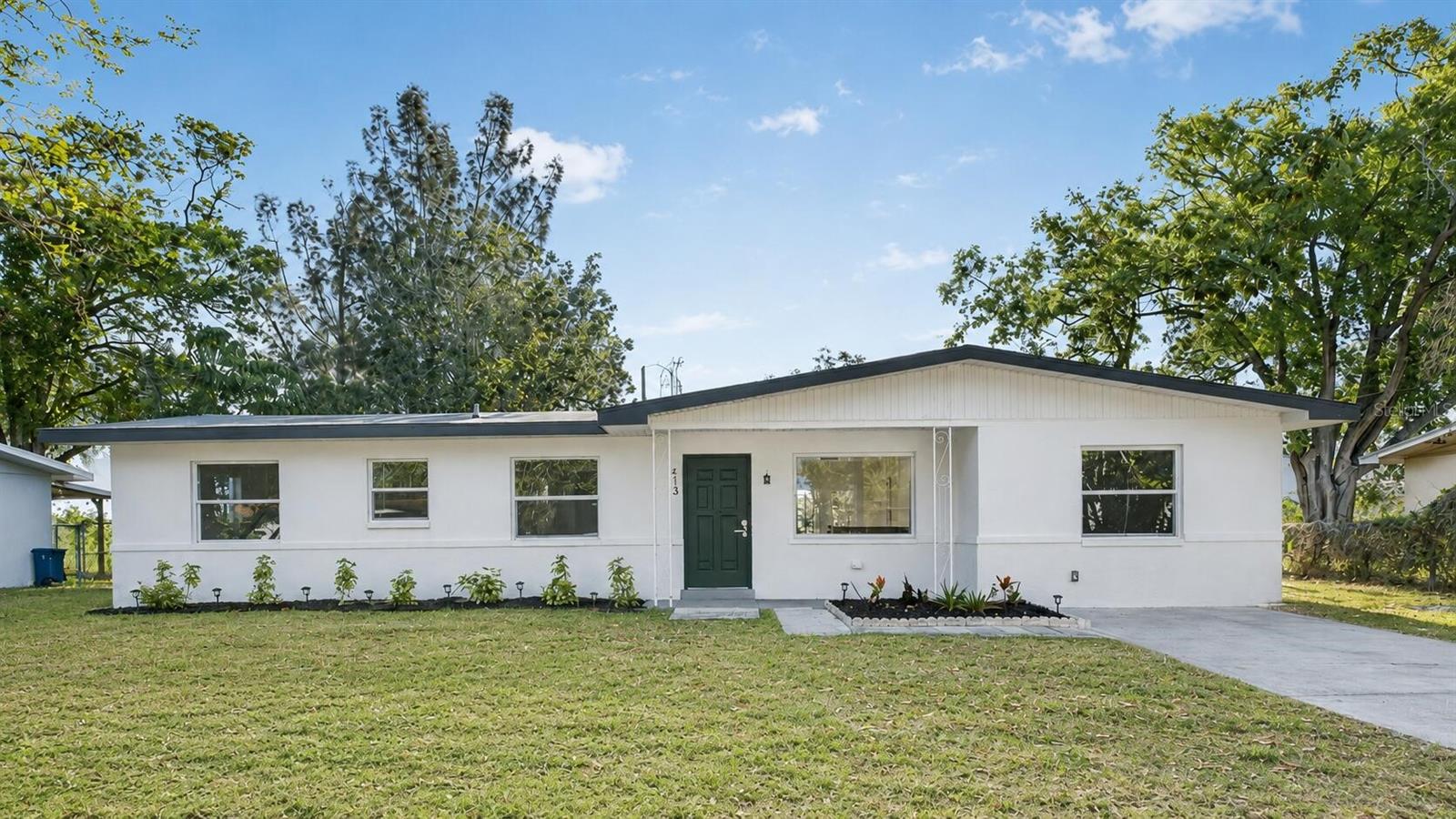 Wake up to water views and end your day watching the sun set over the canal. This renovated 3-bedroom, 2-bathroom waterfront home sits on a spacious 0.21-acre lot with no HOA in the established Oldsmar Country Club Estates, and its best feature is right out the back door: direct water access with a scenic trail leading all the way to Tampa Bay. Launch a kayak or paddleboard from your own backyard and be on the water in minutes. Inside, the home is move-in ready with luxury vinyl flooring throughout and an open, light-filled layout. The renovated kitchen features stainless steel appliances, quartz countertops, and generous cabinetry. The primary suite gives a comfortable retreat with an updated bathroom, modern vanity, designer lighting, and a tiled walk-in shower. Sliding doors off the main living area open to an expansive backyard where the waterfront views take center stage. Enjoy morning coffee, evening entertaining, or simply unwind by the water. The location matches the lifestyle. Walk, bike, or take your golf cart to Mobbly Bayou Beach Park, a public boat launch to Tampa Bay, Tampa Bay Pickleball, Veterans Park, Bicentennial Park, and RE Olds Park. You are also close to Empower Adventures Zip Line and the Oldsmar Organic Community Garden, with Tampa International Airport about 20 minutes away. Zoned for well-regarded schools including Oldsmar Elementary, Joseph L. Carwise Middle, and East Lake High. This is a rare opportunity to own a renovated waterfront home with no HOA in one of Oldsmar's most sought-after communities.