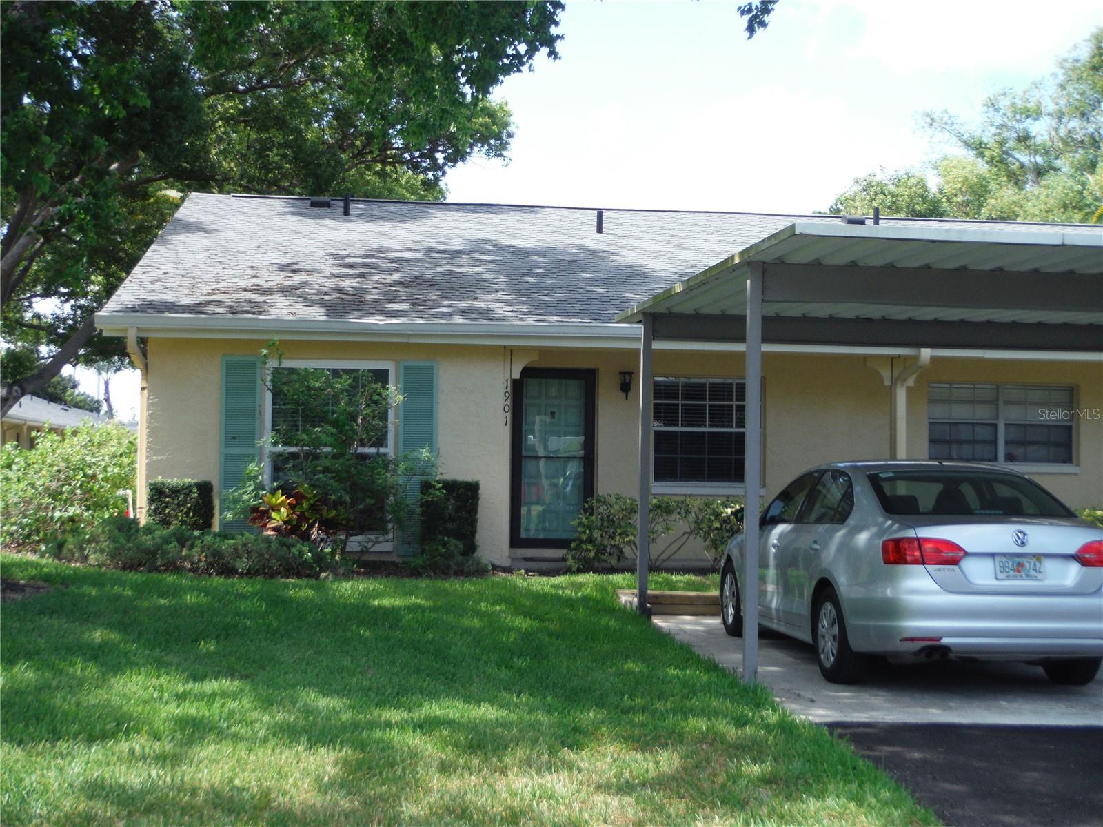 Woodland Villas. This beautiful highly desired end unit located in Woodland Villa's is one of Clearwater's most vibrant 55 plus subdivisions. This end unit has extra windows to help make the home light and bright. This villa also features a private washer and dryer. This villa is in walking distance to restaurants and public transportation. This Villa is located approx. 15 minutes to the Dunedin Causeway, 5 minutes from Countryside mall, grocery store and the gym, 25 minutes to the airport as well as Clearwater Beach. There is an enclosed porch where the full-size washer and dryer are located. The centrally located clubhouse has activities year-round. It also offers designated covered carport parking and a guest parking plus a private outdoor storage space, perfect for keeping extra belongings organized. Community HOA INCLUDES water, sewer, trash Cable TV, Community Pool, Insurance, Internet, Maintenance Exterior, Maintenance Grounds, and Pool Maintenance, . This lovely condo has been meticulously cared for and ready for YOU. Don't miss out!!
