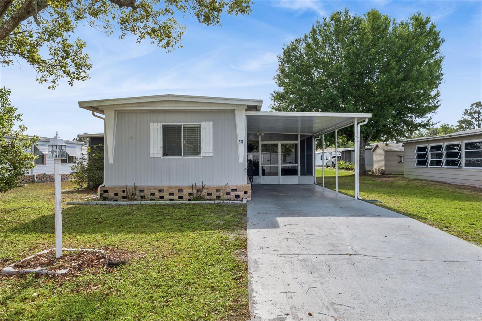 COMPLETELY RENOVATED!! MOVE IN READY!! Welcome to Kove Estates in Osteen! This beautifully updated 2-bedroom, 2-bath home offers comfort, style, and abundant natural light throughout. The completely renovated property features an updated kitchen, granite countertops, new cabinetry, and a gas cooktop—perfect for cooking and entertaining. Both bathrooms have been tastefully updated. Enjoy added functionality with a dedicated laundry room including washer and dryer. Relax and unwind in the screened-in porch or the enclosed sunroom, providing additional living space to enjoy year-round. Recent upgrades include a newer HVAC system (2024), recessed lighting, Updated Subfloors and Newer Flooring throughout, ceiling fans for added comfort and efficiency. 55+ CO-OP Community Resort Style Living at its finest, all the thrills without all the fuss. There is no lot rent, as a share in the community conveys with the sale. With a monthly cooperative fee of $281 which allows you to Enjoy Year Round 9 Hole Golf Course, 2 pools, one heated, tennis courts, pickleball, community events and the peaceful nights all in your very own gated community.  30 minutes to the Beach, 45 minutes to Disney. Light-filled and move-in ready, this home is a must-see in the desirable Kove Estates community!