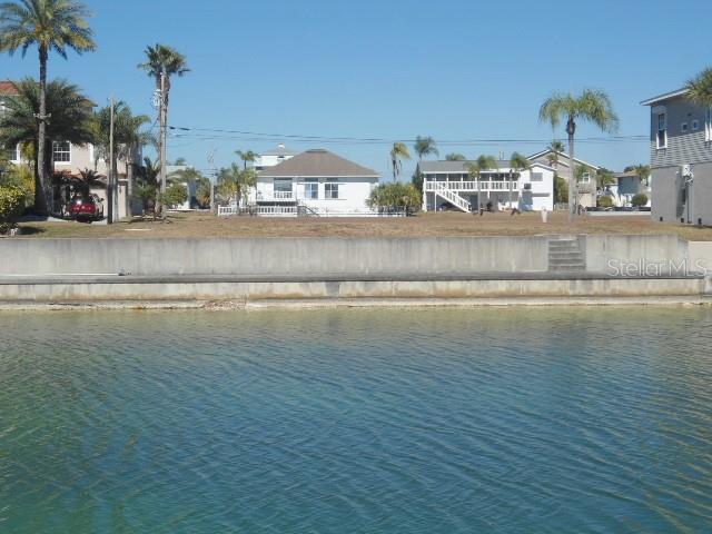 Waterfront lot with seawall located in deed restricted Hernando Beach South. This level lot features a seawall with walkway, secondary wall and steps a 20k value. The deed restrictions require you have a seawall in place before you can start building. Included in the yearly HOA fee is the grass cutting of the lot until you start building. Come build your dream home in this waterfront community upscale homes with boat access to the Gulf of Mexico.