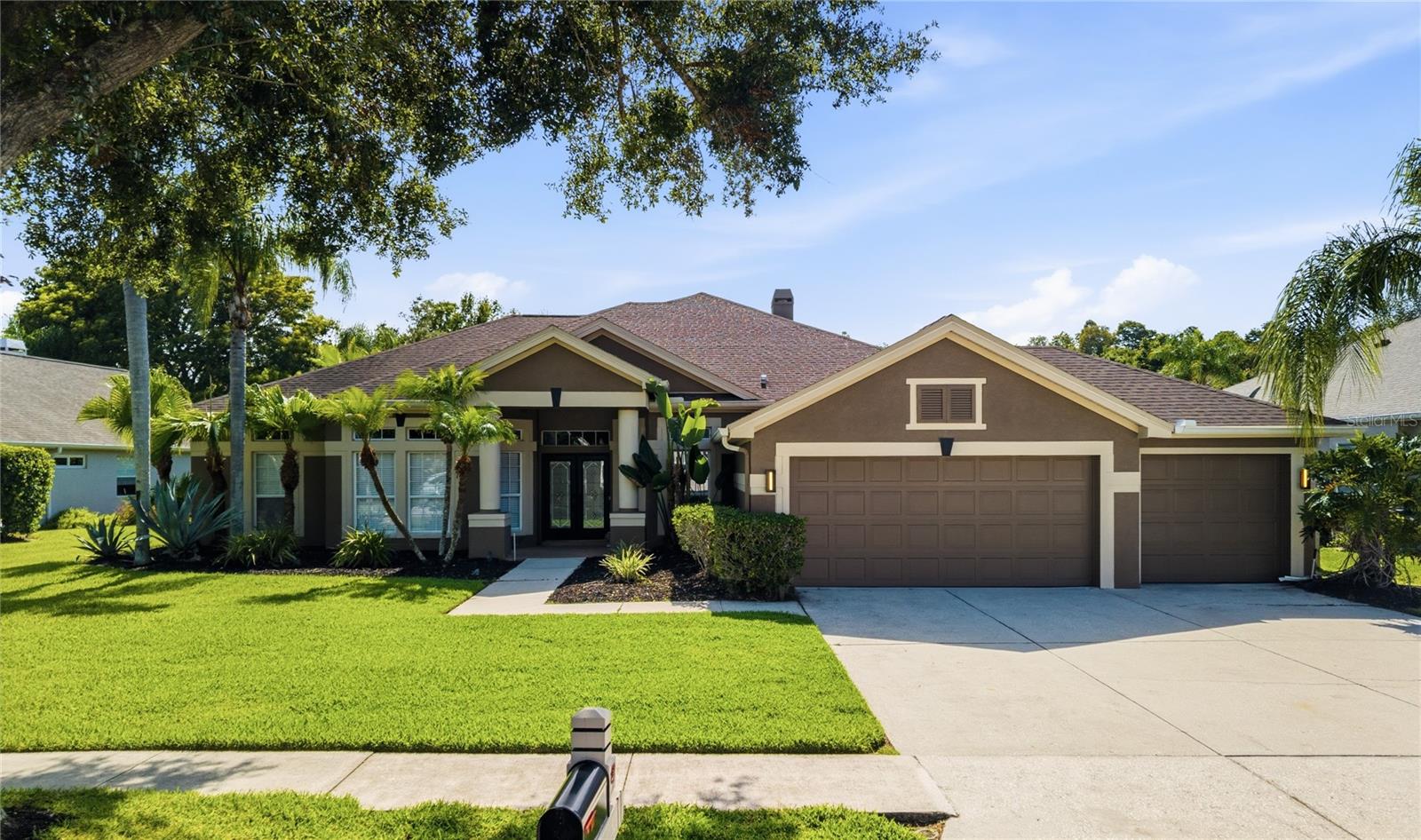 Welcome to this Beautifully maintained 4-Bedroom, 3-Bathroom home located in the sought-after Gated section of the Villarosa community. Offering an exceptional blend of comfort and style, this residence features 2949sf along with a sparkling private pool and spacious pavered lanai, creating the perfect setting for relaxing Florida living and effortless outdoor entertaining. From the moment you arrive, you'll be impressed by the elegant glass door entry, soaring high ceilings, and crown molding accents that enhance the home's refined architectural character. Designed with both privacy and functionality in mind, the desirable double split floor plan provides comfortable separation between the primary suite and secondary bedrooms, making it ideal for families and guests alike. Inside, the thoughtfully Updated Kitchen is designed to impress with elegant Quartz countertops, a built-in Convection Oven, Cooktop, Stainless Steel wall-mounted Range Hood, and abundant workspace for preparing meals and gathering with family and friends. Polished Travertine flooring flows throughout the main Living, Dining, and Kitchen areas, adding timeless elegance and a seamless feel to the home's open-concept design. The spacious floor plan provides generous living areas with a versatile Flex Space currently utilized as a Home Gym. Featuring stylish Barn Doors for added privacy, this room can easily adapt to your lifestyle needs as a Playroom, Media Room, etc. An additional Bonus Area enhances the home's functionality and features custom built-in cabinetry, creating an ideal home office space for remote work, keeping everything organized and within reach. The spacious Primary Suite serves as a private retreat, complete with a large Walk-In Closet and the added comfort of a dedicated mini-split AC system. The luxurious Ensuite Bathroom is designed for relaxation, featuring a serene soaking tub, a large tiled walk-in shower with glass surround doors, and ample space to begin and end each day in comfort. Car enthusiasts, hobbyists, and those seeking additional storage will appreciate the oversized 3-car garage. Thoughtfully equipped for convenience and preparedness, the garage includes a dedicated home generator transfer switch kit. Situated on a Premium Homesite, the backyard offers exceptional privacy and picturesque views of a small pond and wooded conservation area. Enjoy peaceful mornings and relaxing evenings from the pavered lanai while taking in the natural surroundings. Deer are frequently spotted wandering through the backyard, adding to the tranquil setting and creating a true connection with nature. Nestled within one of the area's most desirable communities, this home offers the security of gated access along with convenient proximity to Top-Rated Schools, shopping, dining, parks, and major commuter routes. Whether entertaining poolside, working from home, or enjoying the many comforts this property offers, you'll appreciate the perfect balance of luxury, functionality, and location. Don't miss this opportunity to own a stunning pool home in Villarosa where exceptional living awaits.