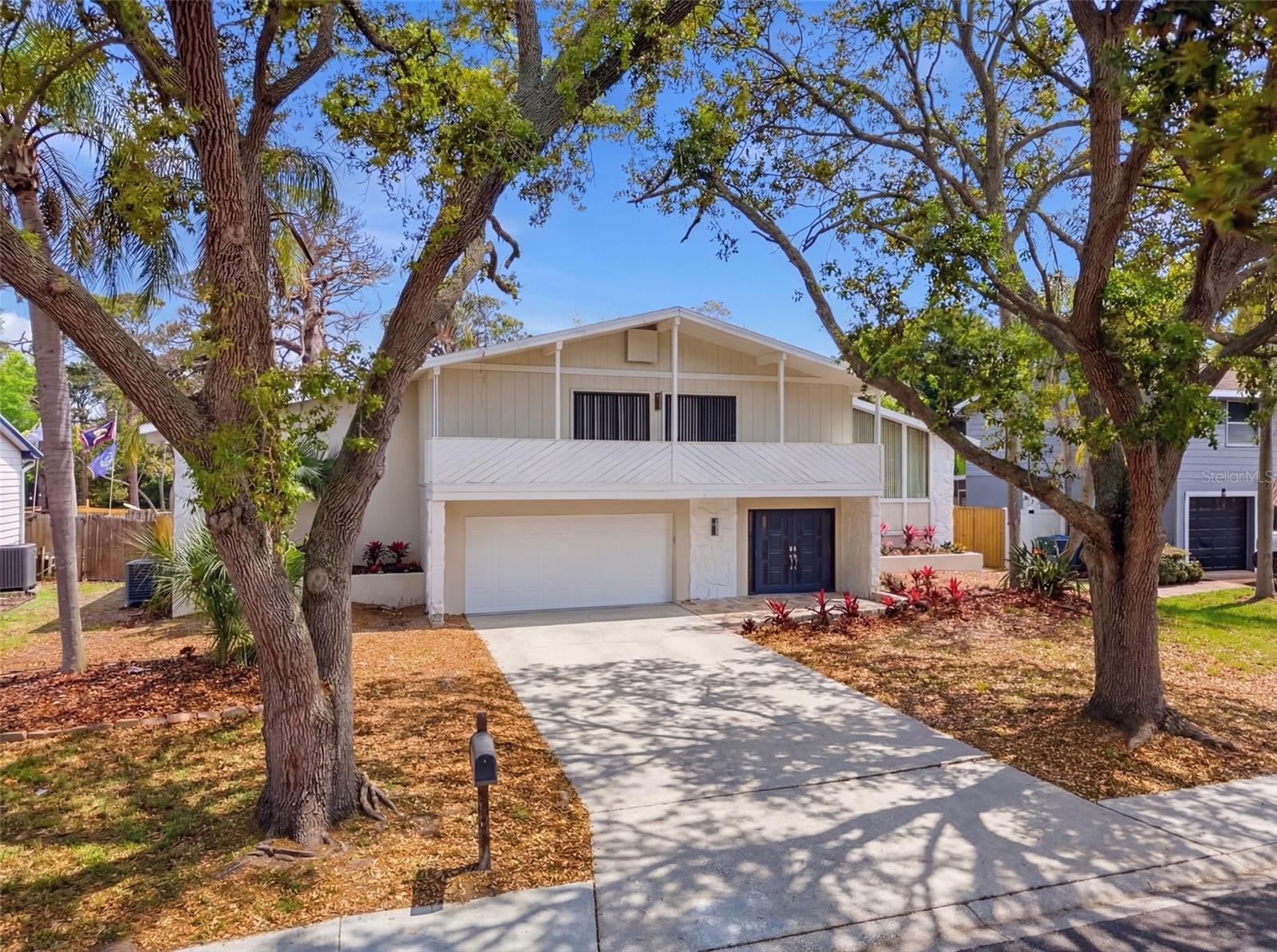 *SELLER WILLING TO CONTRIBUTE TOWARD BUYER CLOSING COSTS* Fully renovated 4/3/2 pool home located in the highly desirable Whispering Pines neighborhood of Seminole. This spacious residence offers a bright, open layout with stylish modern updates throughout. Located in a quintessential Florida neighborhood with easy access to the beach this home has so much to offer a buyer. Luxury vinyl plank flooring runs throughout the home, creating a cohesive and contemporary feel while offering durability and easy maintenance. Multiple living areas provide flexibility for a variety of needs, whether you’re looking for formal and casual spaces, a home office, or a media room. The generous bedroom layout includes well-sized guest rooms and a comfortable primary suite with a walk-in closet, renovated bathroom, and private pool access, all designed for privacy and relaxation. The designer, well-appointed kitchen has been renovated from top to bottom! Featuring soft close cabinets, quartz counter tops, a farmhouse sink, and a full black stainless appliance package (including a wine fridge). There's opportunity for additional living space in the large enclosed upstairs porch with BRAND NEW windows and views down to the sparkling pool. Step outside to your private backyard retreat where the inground pool is surrounded by brand-new pavers, offering plenty of space for outdoor seating, entertaining, or soaking up the Florida sunshine. The updated outdoor space creates a resort-like setting ideal for year-round enjoyment. Situated in a well-established neighborhood, this home is conveniently located a few blocks from parks, shopping, dining, and the Gulf beaches. With extensive renovations and thoughtful updates throughout, this property is move-in ready and offers the perfect blend of style, comfort, and Florida lifestyle. **SELLER WILL INSTALL A NEW ROOF PRIOR TO CLOSING, BUYER CAN CHOOSE THE COLOR**