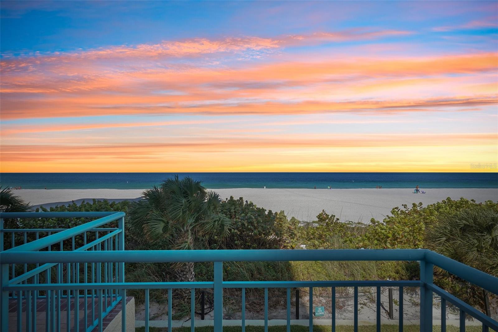 Experience a level of coastal living and entertaining that is simply unmatched. Offered for the first time, this 3-bedroom, 2.5-bath residence with a deeded two-car garage at Ultimar I was the developer’s personal direct beach access ‘penthouse’—meticulously maintained and never before available to the public. Enjoy unobstructed ocean views and private terrace living, just steps above the sand. Residence #202 stands alone as a private corner residence with panoramic beach vistas and an exclusive entryway. The high ceilings and its massive wraparound limestone terrace—the largest and most expansive private outdoor space in Ultimar I —defines the estate with access through a private vestibule. This seamless extension of the home flows directly from the kitchen, main living areas, and primary suite, creating an effortless indoor-outdoor sanctuary perfect for grand entertaining or quiet evenings under the stars. Floor-to-ceiling glass frames sweeping Gulf views from sunrise to sunset, while the terrace itself serves as an elevated outdoor living room for sunset soirées, intimate dinners, and skyline views of downtown Clearwater Beach. The design provides all the privacy, scale, and attributes of a private beachfront residence—without any of the maintenance, upkeep, or operational work. Enhancing this extraordinary setting even further is direct private beach access via your own architectural staircase, leading straight from the expansive terrace to the pristine, sugar-white sands of Sand Key. Step from your private retreat onto the shoreline with complete privacy and ease. Set within the guard-gated enclave of Ultimar I, residents enjoy resort-style amenities, including three heated pools, Har-Tru tennis and pickleball courts, a state-of-the-art fitness center with steam and sauna, and beautifully landscaped grounds with a fire pit, putting green, croquet lawn, and grilling areas. Sand Key delivers serene exclusivity and peaceful beachfront living at its finest. This is a true “one-of-one” opportunity—combining the building’s largest private outdoor footprint, rare high ceilings, direct private beach staircase access, and single-developer ownership in a setting designed for effortless coastal living and entertaining at the highest level.