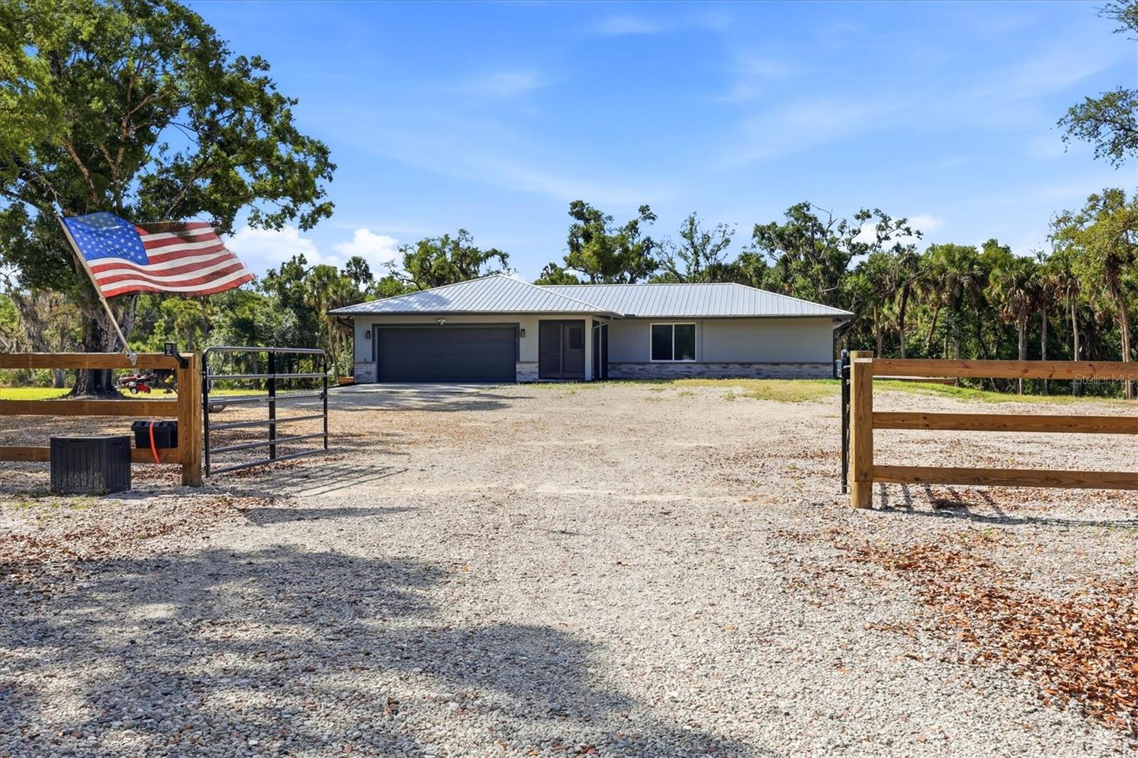 Welcome to your private modern farmhouse retreat in sought-after Myakka Valley! Situated on nearly 6 picturesque acres, this fully updated estate property offers the perfect blend of peaceful country living and modern luxury just minutes from Lakewood Ranch, UTC, I-75, top-rated dining, shopping, and Sarasota’s world-famous beaches. This move-in ready home has been thoughtfully updated with a new metal roof, modern finishes, updated systems, and an open-concept design ideal for everyday living and entertaining. The stunning chef’s kitchen features oversized waterfall quartz countertops, custom cabinetry, smart appliances, and a massive island overlooking the spacious living and dining areas.  Step outside and enjoy wide-open green space, majestic oak trees, privacy, and endless possibilities. Bring your horses, RVs, boats, work vehicles, and outdoor toys — there’s room for it all! The property offers ample space for a future barn, detached workshop, guest house, pool, or additional garages.  Enjoy the rare combination of usable acreage, privacy, and convenience in one of Sarasota’s most desirable country communities. Myakka Valley Ranches is known for its large estate parcels, equestrian-friendly lifestyle, private roads, community parks, and direct access to nature, all while remaining close to everyday conveniences. Whether you’re looking for a family compound, peaceful retreat, entertaining property, or modern country lifestyle, this exceptional property delivers a rare opportunity to own nearly 6 acres of updated Sarasota paradise.