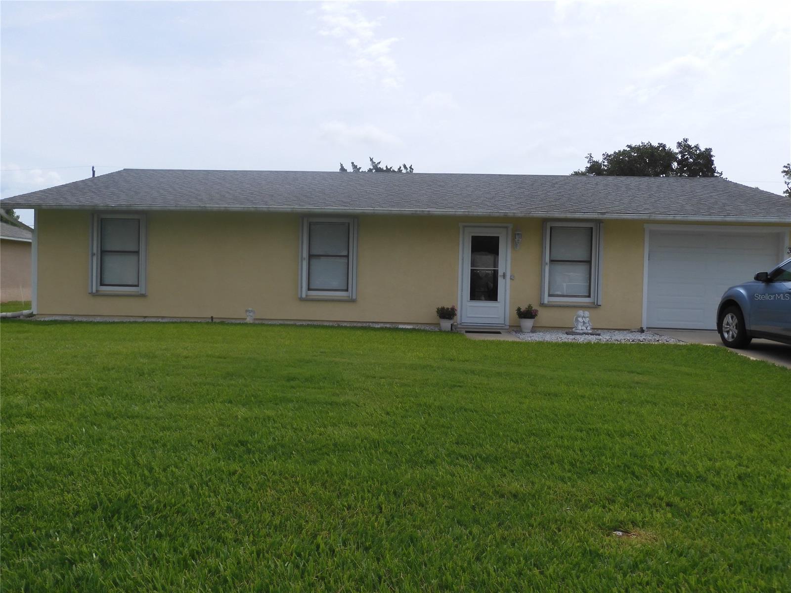 Well maintained 3BR/1.5 Bath home with oversized 1 Car Garage in quiet section of Florida Shores. Situated on a beautiful high lot just off Roberts Rd. which does not require flood insurance & only minutes to Hwy. 1 or SR 442. Spacious lot has room for pool & is maintained by Massey Pest Services with a sprinkler system on reclaimed water. This family home has newer berber carpet in all living areas & MBR, and tiled floors in kitchen & baths.  Newer appliances include D/W in March, 2021, stove/oven new Feb., 2021, A/C new in 2015, two newer high toilets, water heater new in 2013 & roof new in 2005 & garage door opener in April, 2021. Make this your affordable Florida get away home today! ;Water: City