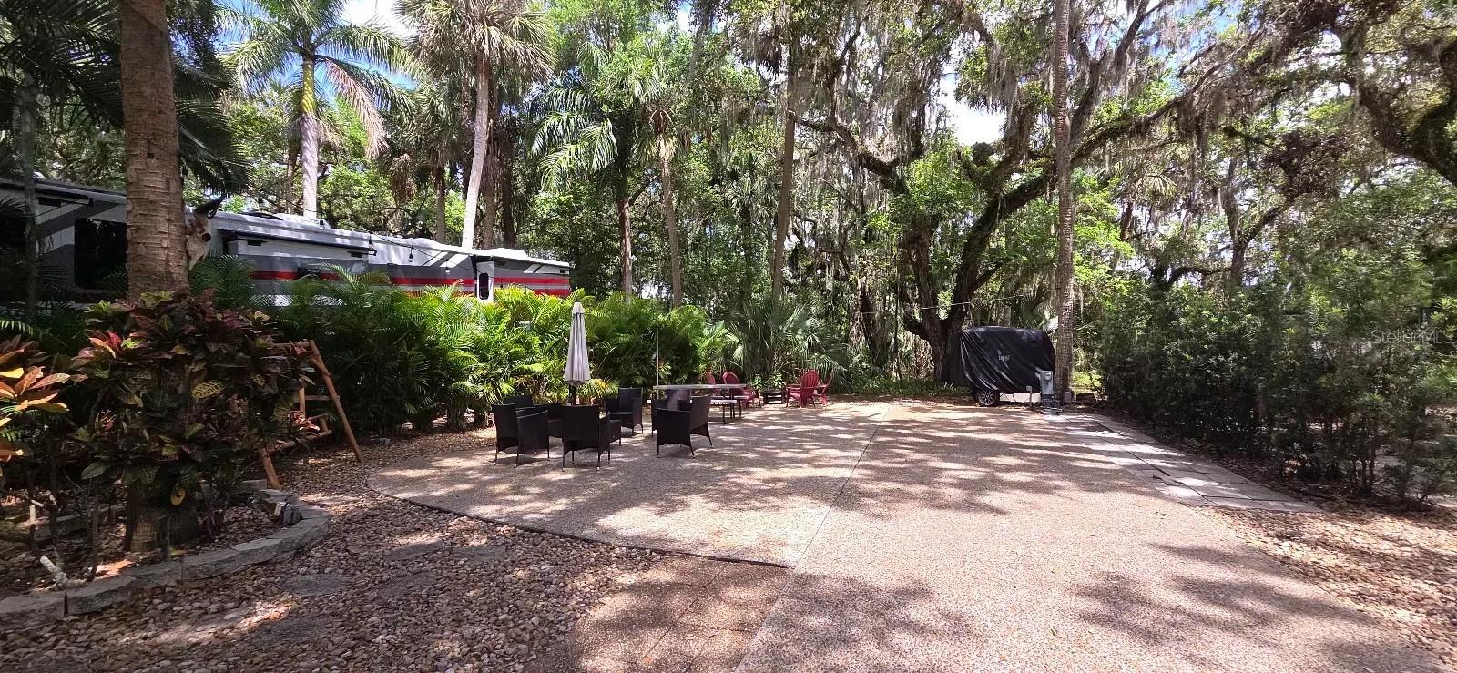 Looking for a LUXURY RV Lot to BUY in FLORIDA?  Look no further!  Full Privacy at this River Ranch Lot in Central Florida!  This gorgeous shaded Deeded RV Lot has no rear neighbors and offers serenity, shade and a peaceful private setting.  This property is located just steps from the Pool, Clubhouse, Laundry and Bathhouse.  The Lot will convey with furnishings and a grill.  Rent the Lot when not in use to off-set expenses.  Enjoy heated pools, pickleball, billiards, a workout room, steam room and more! 
Looking for entertainment and fun? River Ranch offers it here!! For starters, there is a LIVE Rodeo every Saturday night – an excellent display of showmanship and fun for the entire family! There is even a Saloon (family friendly), with LIVE bands, DJs, dance parties and they give line dancing lessons for free. There is a waterpark, an adventure park which has a bounce house, mechanical bull, climbing tower, Arcade, mini golf, outside movie on the greens, bicycle rentals, airboat rides, river boat rides, swamp buggy, hayrides, petting farm, trap & skeet range and a bow target for shooting. There are several places to eat on property. The River Ranch Chop House serves delicious food and drinks, a waterfront Smokehouse Grill serving delicious BBQ, a pizza shop and an ice cream and coffee shop (serving Starbucks.) There is also a General store and a Western store to grab all of your favorite Cowboy/Cowgirl finds! Watch the Bison, Steers, Horses and other wildlife! Don’t forget to check out the Petting Farm!!