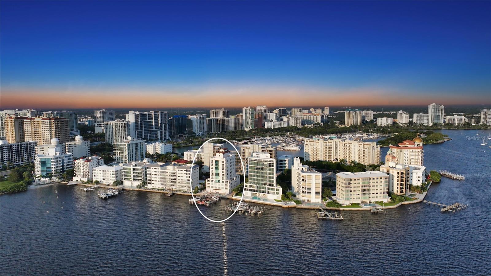 Occupying the entire eighth floor at Majestic Bay Sarasota, this rare three-bedroom plus media room residence defines the art of modern coastal living. Here, panoramic Sarasota Bay views, refined interiors, and the vibrancy of downtown come together in effortless harmony.
Set within the exclusive Golden Gate Point neighborhood—just moments from downtown Sarasota, Bayfront Park, and St. Armands Circle—this home spans over 3,000 square feet of light-filled luxury. Walls of glass showcase sweeping vistas of the John Ringling Bridge, the shimmering bay, and Sarasota’s evolving skyline. Every room offers a front-row seat to the city’s natural beauty—from sunrise over the water to golden evening sunsets and the twinkle of downtown lights.
A secure elevator opens directly into the residence foyer, where travertine floors, high ceilings, and soft neutral finishes set a tone of understated elegance. The open-concept great room connects seamlessly to the dining area and a bay-view terrace, creating an ideal layout for both relaxed living and sophisticated entertaining.
The chef’s kitchen is appointed with rich wood cabinetry, granite countertops, a Wolf gas range, Sub-Zero refrigeration, built-in ovens, and an extended breakfast bar. A cozy morning nook with built-in workspace and east-facing windows captures gentle daylight—perfect for coffee and quiet starts.
The primary suite anchors the northwest corner, offering privacy and stunning water views. French doors open to a private bayfront terrace, while the spacious walk-in closet and spa-inspired bath—with dual vanities, soaking tub, and glass-enclosed shower—create a true retreat. Two additional guest suites, each with en-suite baths, provide inviting accommodations, and a separate media room or office offers flexibility for today’s lifestyle.
North- and south-facing terraces embrace Sarasota’s indoor-outdoor spirit, framing ever-changing bay and skyline views. The residence includes a private two-car garage and a deep-water dock with a 10,000-lb lift—ideal for exploring the Intracoastal Waterway or venturing into the Gulf of Mexico.
Majestic Bay is an intimate, ten-residence community celebrated for its privacy and boutique lifestyle. Amenities include a heated bayfront pool and spa, fitness center, club room, and outdoor kitchen for complete peace of mind.
Outside your door, experience the best of downtown Sarasota living: stroll to the Marina Jack waterfront, Selby Gardens, and The Bay Park, or bike across the Ringling Bridge to St. Armands Circle for shopping, dining, and beach days on Lido Key. The Van Wezel Performing Arts Hall, Sarasota Opera House, and world-class galleries are minutes away, while Siesta Key Beach and the Gulf’s turquoise waters await just beyond.
This full-floor Majestic Bay residence offers an unparalleled combination of space, privacy, and panoramic views—a rare opportunity to own one of Sarasota’s most distinctive addresses and live immersed in the beauty of the bay.