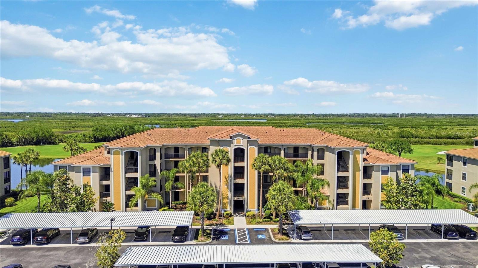 Welcome to River Strand Golf & Country Club within Heritage Harbour, where resort-style living meets one of the best value opportunities in a deeded golf community. This beautifully maintained condo offers stunning lake and golf course views, a private screened lanai, and the rare advantage of being sold completely turnkey furnished—allowing you to move right in or begin generating rental income immediately.

Inside, the open-concept layout creates a bright and inviting living space, with seamless flow between the kitchen, dining, and living areas. The kitchen features granite countertops, a breakfast bar, island workspace, pantry, and solid wood cabinetry, all designed to stay connected to the main living space. Ceramic tile and luxury vinyl flooring run throughout, offering both style and durability. The split-bedroom design provides privacy, with a spacious primary suite featuring a walk-in closet and en-suite bath, while the secondary bedroom is ideal for guests.

Step out to the screened-in patio and take in peaceful water and golf course views, creating the perfect setting for morning coffee or evening relaxation. Additional conveniences include a private storage room and covered parking space (#202), adding both functionality and ease of living.

Recent updates and features include a new HVAC system (2024), water heater (2022), garbage disposal replaced last year, and furniture that is approximately four years old. Appliances are all consistent in age and well maintained, making this a truly move-in-ready opportunity.

Located within a gated community, River Strand offers an unmatched lifestyle with 24-hour security and a full suite of amenities. Ownership includes deeded golf membership along with access to multiple resort-style pools, clubhouse, fitness center, tennis courts, and recreational facilities, all included within the HOA.

The HOA covers an extensive list of services including cable, internet, water, sewer, exterior maintenance, landscaping, and recreational amenities, creating a true lock-and-leave, maintenance-free lifestyle.

Whether you are looking for a full-time residence, seasonal retreat, or investment property with flexible rental options, this turnkey condo offers exceptional value within one of the area’s most sought-after golf communities.

Schedule your private showing today and experience the lifestyle River Strand has to offer.