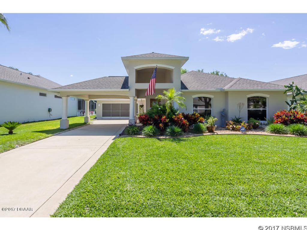 Back on the market and priced to sell!! Financing fell through but their loss is your gain.    Home has passed all inspections and has appraised. The title work is done and ready for a quick close.    Beautiful and meticulously maintained describes this lakefront, Johnson built gem! Between the lovely serene landscape that is supported by an updated irrigation system and the many upgrades this home has to offer you cant go wrong.     This superb concrete block home has tile in all rooms except the bedrooms which are carpet. Past the foyer into the gathering room you will find a custom designed wall unit which could be negotiated into the contract. The home offers a split bedroom plan offers comfort and privacy as well as an over-sized master bedroom suite. The walk in closet doubles as a safe room and the master bath features double vanity and whirlpool tub.     The upgraded kitchen features high end Samsung stainless appliances that carry a warranty till 2019. Enjoy cooking with the convection microwave and duo flex oven. There is an intercom/radio system through out the open floor plan as well as security system.     The Attic has 2 solar exhaust fans that keep it ventilated and cool. The double pained windows are tinted, 140 mile wind rated and are equipped with storm shutters.     The HUGE enclosed Florida family room is both charming and efficient. It includes wood blinds (for max privacy or open them up for a gorgeous view of the lake, water birds and rocket launches). The 40 inch wide back door allows for large furniture in and out with ease or handicap access. Keep the party going with the dry bar that boasts 8 feet of light oak counter top and cabinets. All wood blinds and plantations shutters are included.    There is plenty of parking in your 3 space driveway with motor court (built in carport) or screened in 2 car garage.    This home is beautiful and completely move in ready! The only thing missing is you!!!! ;Water: City