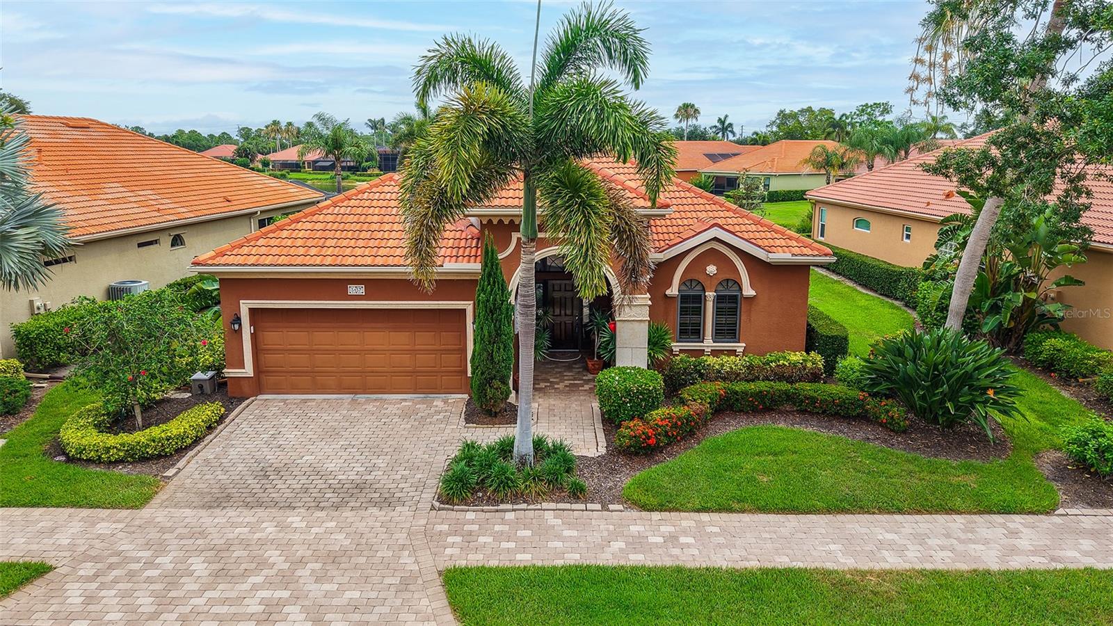 Tuscan style maintenance free home, Expanded to nearly 2500 sq. ft. under air. This open great room floor plan features 3 bedrooms (one is used as an office). Tiled throughout the living area. Wood floors in master bedroom & second bedroom/office. AC has been updated, compressor in 2019 & air handler in 2022. Kitchen features wood cabinets, graneet counters & stainless appliances. Private pool with disappearing edge on water lot with preserve. Only The Vineyards homes have access to the amenities. Maintenance fee includes all landscaping & irrigation system maintenance. Located in the heart of Palmer Ranch adjacent to The Legacy Bike trail near shopping, restaurants & minutes to world famous Siesta Key Beach.